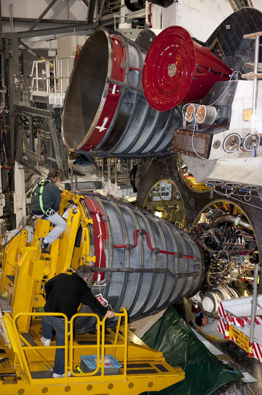 CAPE CANAVERAL, Fla. -- In Orbiter Processing Facility-1 at NASA's Kennedy Space Center in Florida, a Hyster forklift moves the second of three space shuttle main engines closer to shuttle Atlantis for installation. Each engine is 14 feet long, weighs about 6,700 pounds, and is 7.5 feet in diameter at the end of the nozzle. This is the final planned engine installation for the Space Shuttle Program.    Atlantis is being prepared for the "launch on need," or potential rescue mission, for the final planned shuttle flight, Endeavour's STS-134 mission. For more information, visit www.nasa.gov/shuttle. Photo credit: NASA/Kim Shiflett
