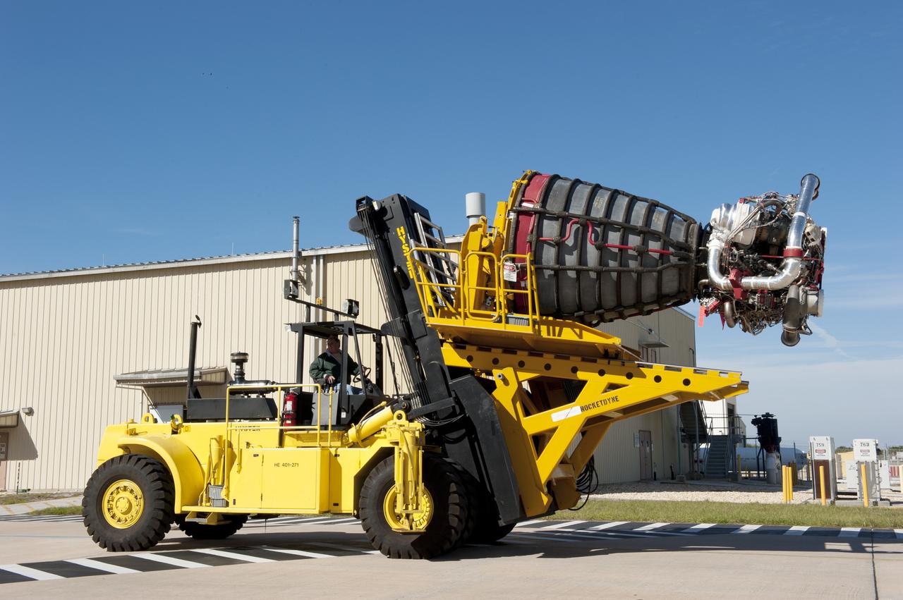CAPE CANAVERAL, Fla. -- A Hyster forklift transports engine #2, the last of shuttle Atlantis' three main engines, from the Space Shuttle Main Engine (SSME) Shop to Orbiter Processing Facility-1 at NASA's Kennedy Space Center in Florida.             Inside the processing facility, the engine will be installed in the shuttle. Each engine is 14 feet long, weighs about 6,700 pounds, and is 7.5 feet in diameter at the end of the nozzle. This is the final planned engine installation for the Space Shuttle Program. Atlantis is being prepared for the "launch on need," or potential rescue mission, for the final planned shuttle flight, Endeavour's STS-134 mission. For more information, visit www.nasa.gov/shuttle. Photo credit: NASA/Kim Shiflett