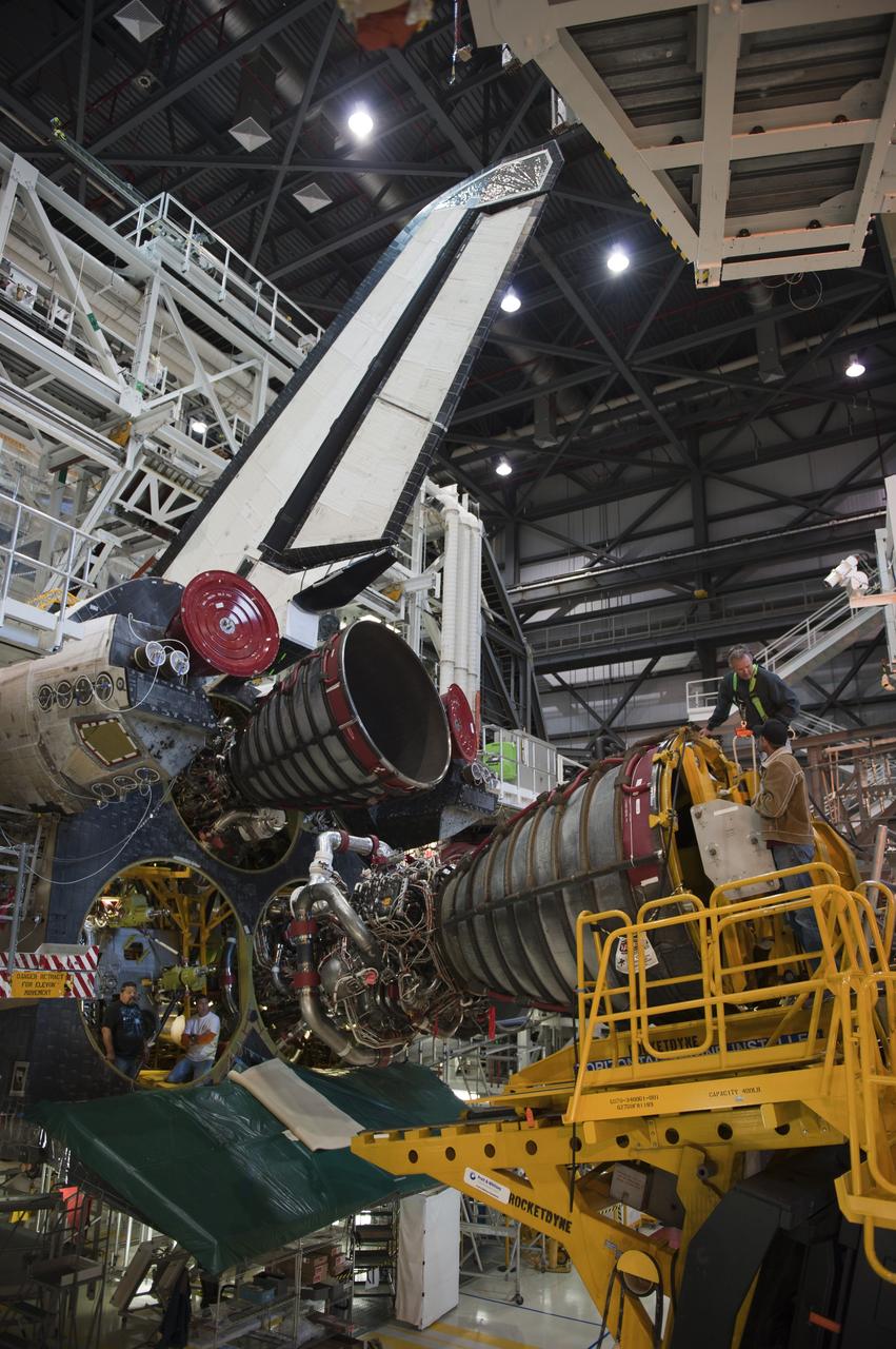 CAPE CANAVERAL, Fla. -- In Orbiter Processing Facility-1 at NASA's Kennedy Space Center in Florida, a Hyster forklift moves engine #2, the last of three space shuttle main engines, into position for installation on shuttle Atlantis.     Each engine is 14 feet long, weighs about 6,700 pounds, and is 7.5 feet in diameter at the end of the nozzle. This is the final planned engine installation for the Space Shuttle Program. Atlantis is being prepared for the "launch on need," or potential rescue mission, for the final planned shuttle flight, Endeavour's STS-134 mission. For more information, visit www.nasa.gov/shuttle. Photo credit: NASA/Kim Shiflett