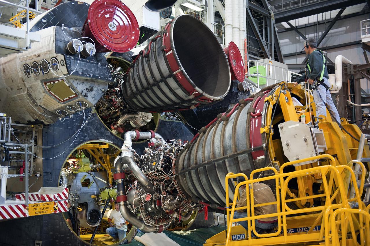 CAPE CANAVERAL, Fla. -- In Orbiter Processing Facility-1 at NASA's Kennedy Space Center in Florida, a Hyster forklift moves engine #2, the last of three space shuttle main engines, into position for installation on shuttle Atlantis.     Each engine is 14 feet long, weighs about 6,700 pounds, and is 7.5 feet in diameter at the end of the nozzle. This is the final planned engine installation for the Space Shuttle Program. Atlantis is being prepared for the "launch on need," or potential rescue mission, for the final planned shuttle flight, Endeavour's STS-134 mission. For more information, visit www.nasa.gov/shuttle. Photo credit: NASA/Kim Shiflett
