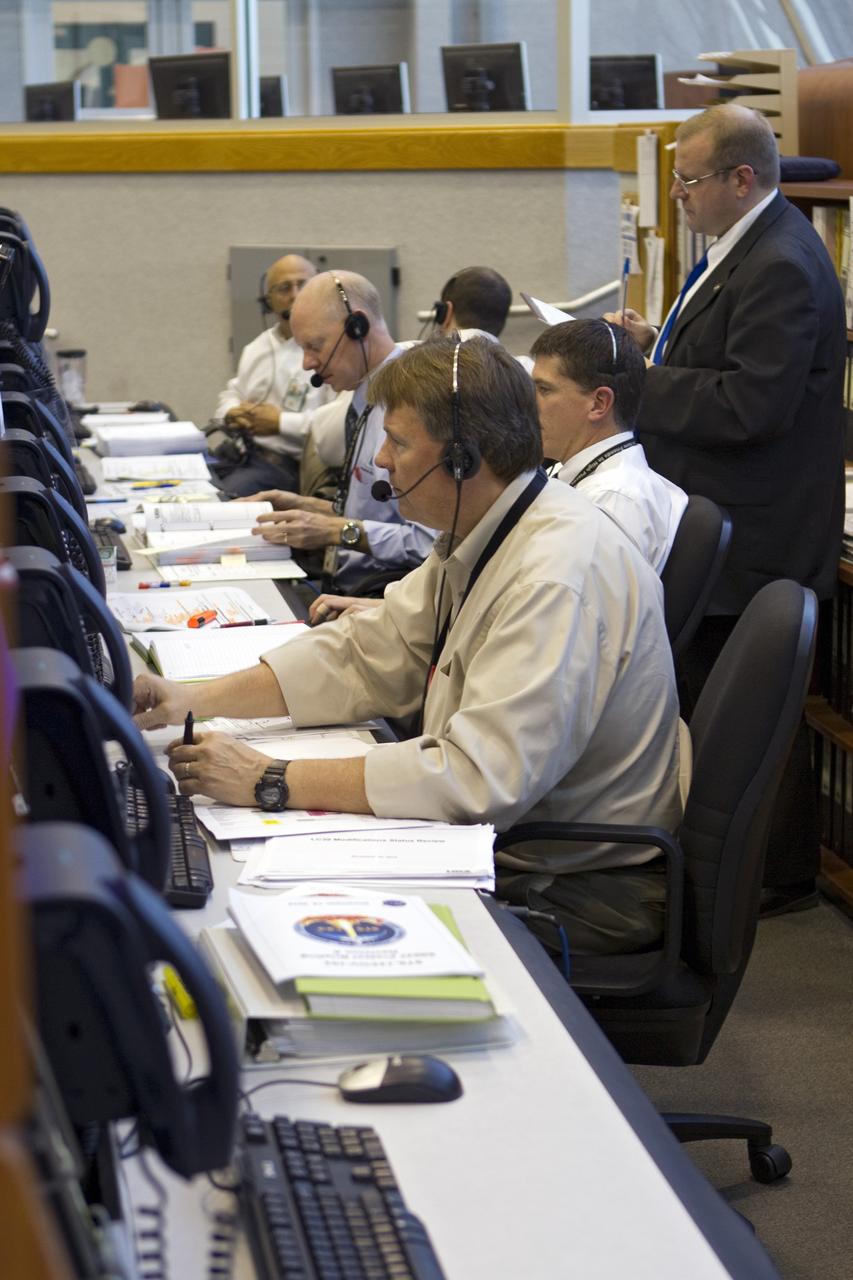 CAPE CANAVERAL, Fla. -- Team members stationed at consoles in the Launch Control Center at NASA's Kennedy Space Center in Florida monitor space shuttle Discovery's external fuel tank as it is loaded with more than 535,000 gallons of cryogenic propellants. From back, are Assistant Launch Orbiter Test Conductor Mark Taffet, Launch Orbiter Test Conductor John Kracsun, STS-133 NASA Test Director Steve Payne, NASA Commentator Allard Beutel, NASA Test Director Jeremy Graeber and STS-133 Assistant NASA Test Director Jeff Spaulding. During today's tanking test, the team is paying particular attention to the external tank's ribbed intertank region. Beginning tomorrow, engineers will evaluate data on 21-foot-long, U-shaped aluminum brackets, called stringers, and the newly replaced ground umbilical carrier plate (GUCP). Discovery's first launch attempt for STS-133 was scrubbed in early November due to a hydrogen gas leak at the GUCP. In order to perform additional analysis on the tank, Discovery will be rolled back to the Vehicle Assembly Building, a move that is planned for next week. The next launch opportunity is no earlier than Feb. 3, 2011. For more information on STS-133, visit www.nasa.gov/mission_pages/shuttle/shuttlemissions/sts133/. Photo credit: NASA/Cory Huston