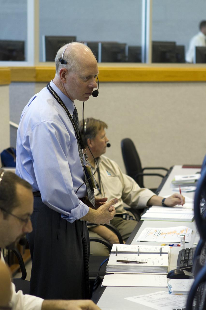 CAPE CANAVERAL, Fla. -- Team members stationed at consoles in the Launch Control Center at NASA's Kennedy Space Center in Florida monitor space shuttle Discovery's external fuel tank as it is loaded with more than 535,000 gallons of cryogenic propellants. From back, are STS-133 Assistant NASA Test Director Jeff Spaulding, STS-133 NASA Test Director Steve Payne and Launch Orbiter Test Conductor John Kracsun. During today's tanking test, the team is paying particular attention to the external tank's ribbed intertank region. Beginning tomorrow, engineers will evaluate data on 21-foot-long, U-shaped aluminum brackets, called stringers, and the newly replaced ground umbilical carrier plate (GUCP). Discovery's first launch attempt for STS-133 was scrubbed in early November due to a hydrogen gas leak at the GUCP. In order to perform additional analysis on the tank, Discovery will be rolled back to the Vehicle Assembly Building, a move that is planned for next week. The next launch opportunity is no earlier than Feb. 3, 2011. For more information on STS-133, visit www.nasa.gov/mission_pages/shuttle/shuttlemissions/sts133/. Photo credit: NASA/Cory Huston