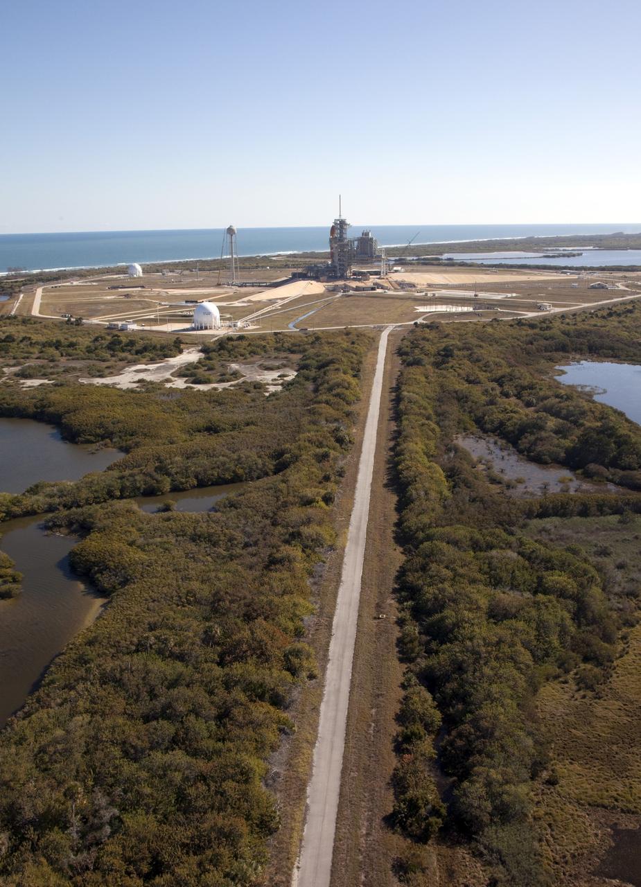 CAPE CANAVERAL, Fla. -- Space shuttle Discovery awaits its move, called rollback, from Launch Pad 39A to the Vehicle Assembly Building (VAB) at NASA's Kennedy Space Center in Florida. Rollback was scheduled for 12:30 a.m., but was postponed until 10 p.m. so technicians could resolve an issue with a leveling system on the crawler-transporter. Once inside the VAB, Discovery's external fuel tank will be examined and foam reapplied where 89 sensors were installed on the tank's aluminum skin for an instrumented tanking test on Dec. 17. The sensors were used to measure changes in the tank as super-cold propellants were pumped in and drained out. Data and analysis from the test will be used to determine what caused the tops of two, 21-foot-long support beams, called stringers, on the outside of the intertank to crack during fueling on Nov. 5.                  Discovery's next launch opportunity to the International Space Station on the STS-133 mission is no earlier than Feb. 3, 2011. For more information on STS-133, visit www.nasa.gov/mission_pages/shuttle/shuttlemissions/sts133/. Photo credit: NASA/Frank Michaux