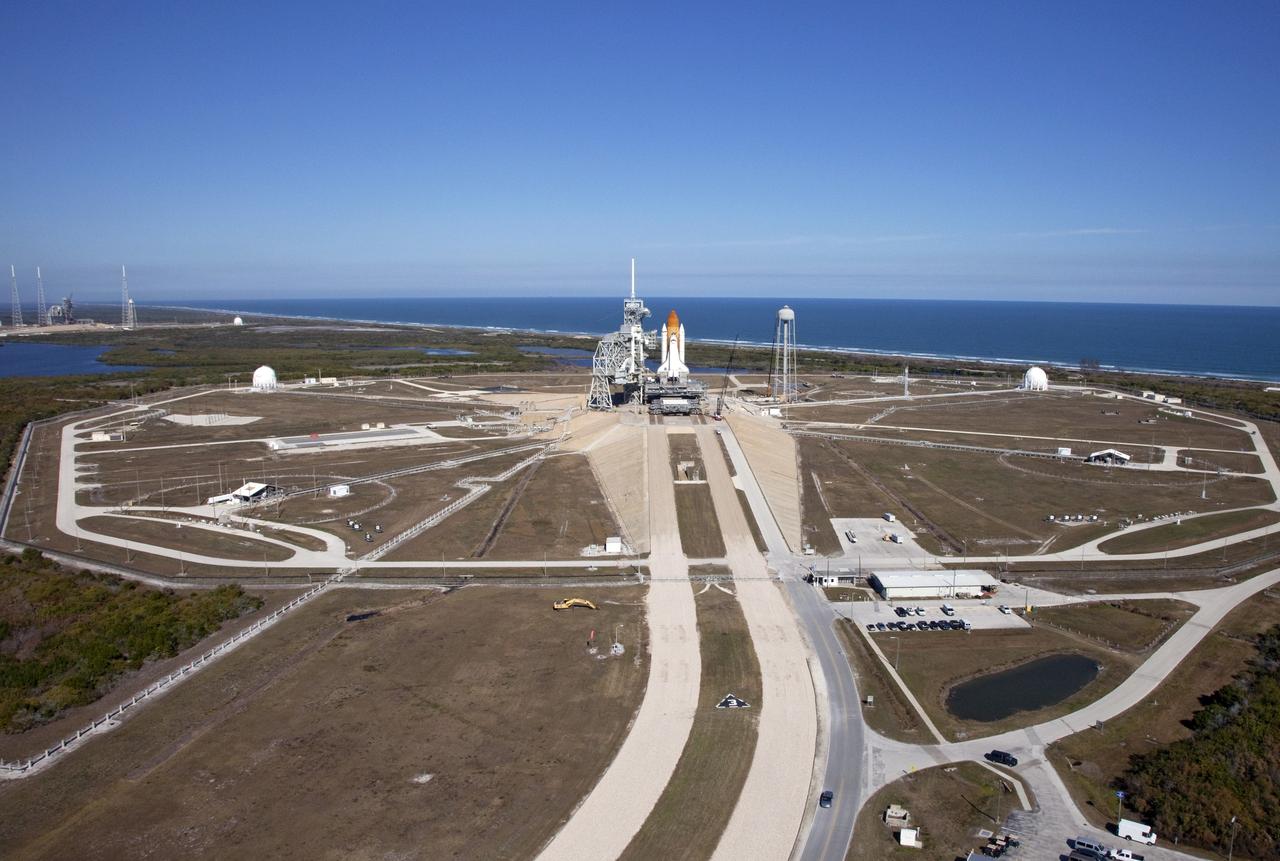 CAPE CANAVERAL, Fla. -- Space shuttle Discovery awaits its move, called rollback, from Launch Pad 39A to the Vehicle Assembly Building (VAB) at NASA's Kennedy Space Center in Florida. Rollback was scheduled for 12:30 a.m., but was postponed until 10 p.m. so technicians could resolve an issue with a leveling system on the crawler-transporter, which is in front of the shuttle. Once inside the VAB, Discovery's external fuel tank will be examined and foam reapplied where 89 sensors were installed on the tank's aluminum skin for an instrumented tanking test on Dec. 17. The sensors were used to measure changes in the tank as super-cold propellants were pumped in and drained out. Data and analysis from the test will be used to determine what caused the tops of two, 21-foot-long support beams, called stringers, on the outside of the intertank to crack during fueling on Nov. 5.    Discovery's next launch opportunity to the International Space Station on the STS-133 mission is no earlier than Feb. 3, 2011. For more information on STS-133, visit www.nasa.gov/mission_pages/shuttle/shuttlemissions/sts133/. Photo credit: NASA/Frank Michaux
