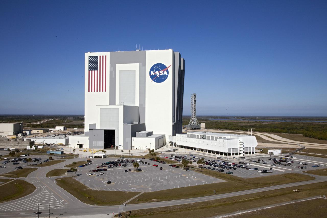 CAPE CANAVERAL, Fla. -- This is an aerial view of the Vehicle Assembly Building, center, Launch Control Center, right, and NASA's new mobile launcher, back, in the Launch Complex 39 area of NASA's Kennedy Space Center in Florida.    Photo credit: NASA/Frank Michaux