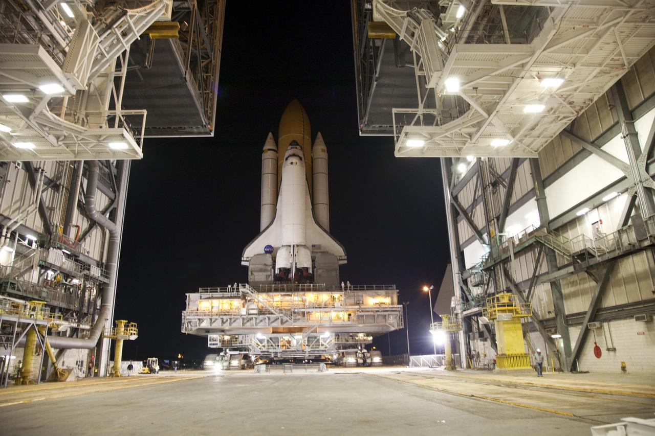 CAPE CANAVERAL, Fla. -- The bright lights inside the Vehicle Assembly Building at NASA's Kennedy Space Center in Florida invite space shuttle Discovery inside. The 3.4-mile trek, called rollback, from Launch Pad 39A began at 10:48 p.m. yesterday and took about eight hours. Next, Discovery's external fuel tank will be examined and foam reapplied where 89 sensors were installed on the tank's aluminum skin for an instrumented tanking test on Dec. 17. The sensors were used to measure changes in the tank as super-cold propellants were pumped in and drained out. Data and analysis from the test will be used to determine what caused the tops of two, 21-foot-long support beams, called stringers, on the outside of the intertank to crack during fueling on Nov. 5.      Discovery's next launch opportunity to the International Space Station on the STS-133 mission is no earlier than Feb. 3, 2011. For more information on STS-133, visit www.nasa.gov/mission_pages/shuttle/shuttlemissions/sts133/. Photo credit: NASA/Frank Michaux