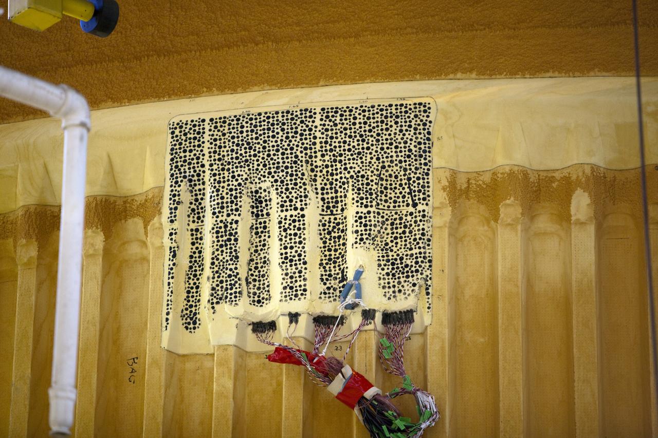 CAPE CANAVERAL, Fla. -- Technicians in the Vehicle Assembly Building at NASA's Kennedy Space Center in Florida will begin to remove thermal sensors that will give engineers data about the changes space shuttle Discovery's external fuel tank went through during the loading and draining of super-cold propellants during a tanking test on Dec. 17. Engineers also will examine 21-foot-long support beams, called stringers, on the outside of the tank's intertank region. Also on the agenda, is to re-apply foam to the outside of the tank. Discovery's next launch opportunity to the International Space Station on the STS-133 mission is no earlier than Feb. 3, 2011. For more information on STS-133, visit www.nasa.gov/mission_pages/shuttle/shuttlemissions/sts133/. Photo credit: NASA/Dimitri Gerondidakis