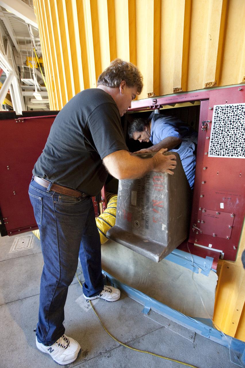 CAPE CANAVERAL, Fla. -- Preparations are under way in the Vehicle Assembly Building at NASA's Kennedy Space Center in Florida to examine space shuttle Discovery's external fuel tank. Technicians will begin to remove thermal sensors that will give engineers data about the changes the tank went through during the loading and draining of super-cold propellants during a tanking test on Dec. 17. Engineers also will examine 21-foot-long support beams, called stringers, on the outside of the tank's intertank region. Also on the agenda, is to re-apply foam to the outside of the tank. Discovery's next launch opportunity to the International Space Station on the STS-133 mission is no earlier than Feb. 3, 2011. For more information on STS-133, visit www.nasa.gov/mission_pages/shuttle/shuttlemissions/sts133/. Photo credit: NASA/Dimitri Gerondidakis