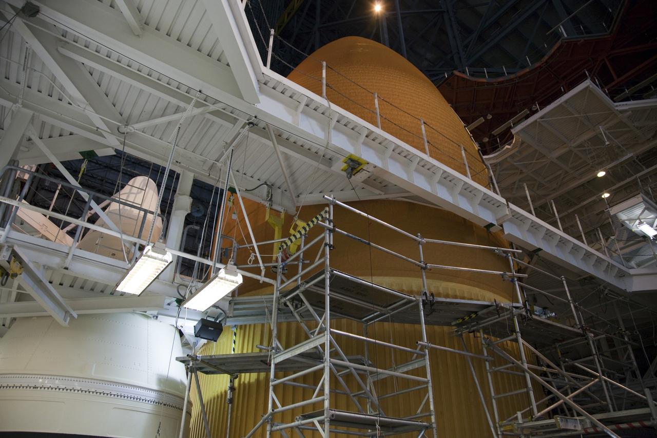CAPE CANAVERAL, Fla. -- Space shuttle Discovery's external fuel tank is being prepared for computed radiography scans inside the Vehicle Assembly Building at NASA's Kennedy Space Center in Florida. The shuttle stack, consisting of the shuttle, external tank and solid rocket boosters, was moved off Launch Pad 39A so technicians could examine 21-foot-long support beams, called stringers, on the outside of the tank's intertank and re-apply foam insulation. Discovery's next launch opportunity to the International Space Station on the STS-133 mission is no earlier than Feb. 3, 2011. For more information on STS-133, visit www.nasa.gov/mission_pages/shuttle/shuttlemissions/sts133/. Photo credit: NASA/Frankie Martin