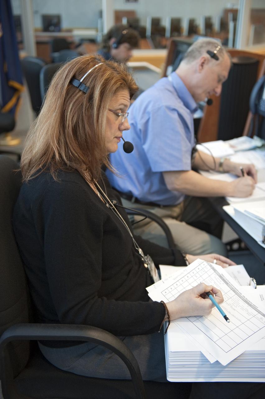 CAPE CANAVERAL, Fla. -- In the Launch Control Center at NASA's Kennedy Space Center in Florida, NASA Test Director Charlie Blackwell-Thompson sits at her console in Firing Room 4 along with other STS-133 launch team members to rehearse procedures for the liftoff of space shuttle Discovery's final mission. The team at Kennedy also participated in launch simulations with personnel at NASA's Johnson Space Center in Houston. Discovery's next launch opportunity to the International Space Station on the STS-133 mission is planned for no earlier than Feb. 24. For more information on STS-133, visit www.nasa.gov/mission_pages/shuttle/shuttlemissions/sts133/. Photo credit: NASA/Kim Shiflett