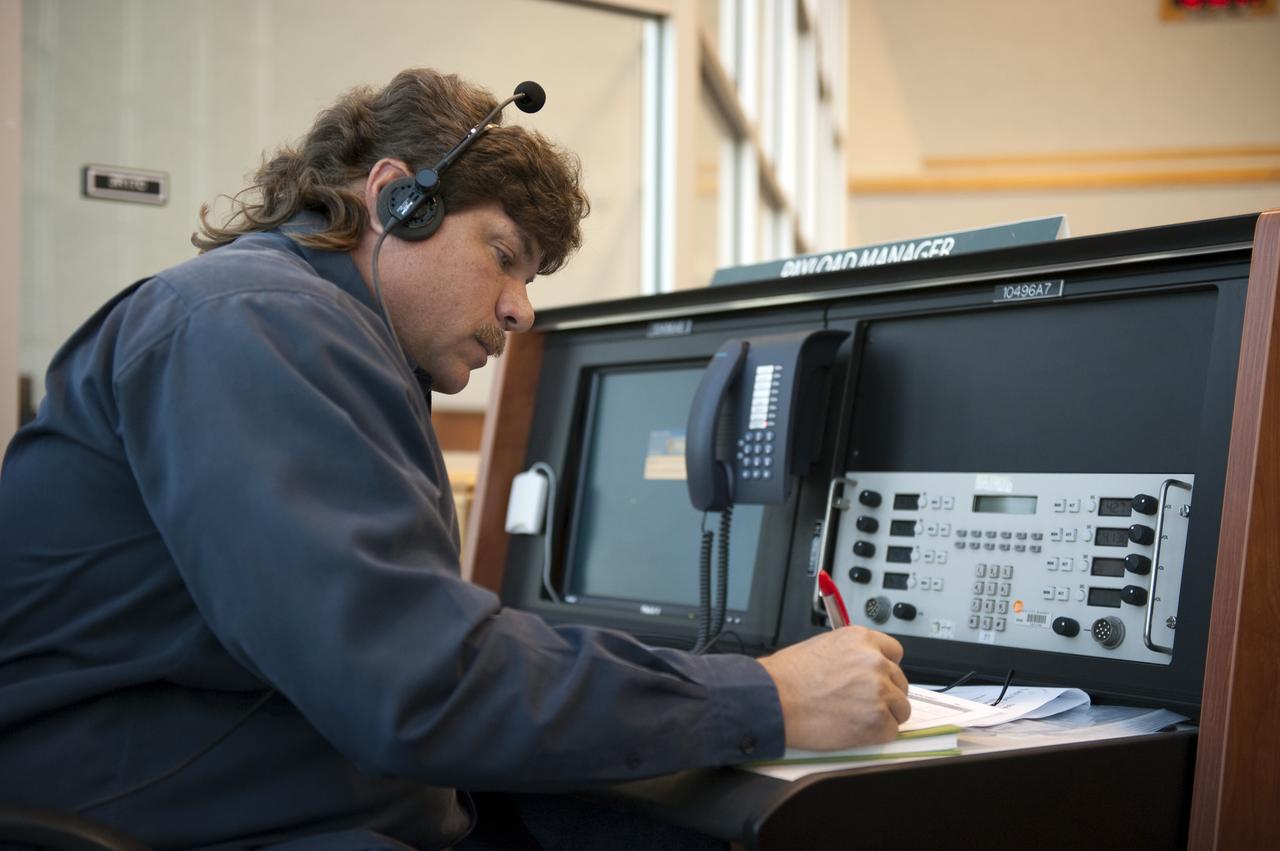 CAPE CANAVERAL, Fla. -- In the Launch Control Center at NASA's Kennedy Space Center in Florida, Bart Pannullo, the vehicle processing engineer for space shuttle Discovery, sits at his console in Firing Room 4 along with other STS-133 launch team members to rehearse procedures for the liftoff of Discovery's final mission. The team at Kennedy also participated in launch simulations with personnel at NASA's Johnson Space Center in Houston. Discovery's next launch opportunity to the International Space Station on the STS-133 mission is planned for no earlier than Feb. 24. For more information on STS-133, visit www.nasa.gov/mission_pages/shuttle/shuttlemissions/sts133/. Photo credit: NASA/Kim Shiflett