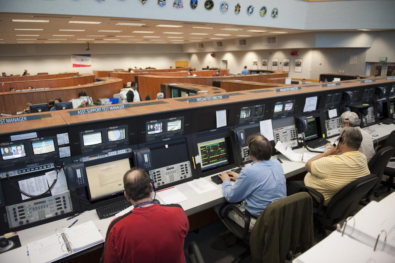CAPE CANAVERAL, Fla. -- At NASA's Kennedy Space Center in Florida, STS-133 launch team members rehearse procedures for the liftoff of space shuttle Discovery's final mission in Firing Room 4. The team at Kennedy also participated in launch simulations with personnel at NASA's Johnson Space Center in Houston. Discovery's next launch opportunity to the International Space Station on the STS-133 mission is planned for no earlier than Feb. 24. For more information on STS-133, visit www.nasa.gov/mission_pages/shuttle/shuttlemissions/sts133/. Photo credit: NASA/Kim Shiflett