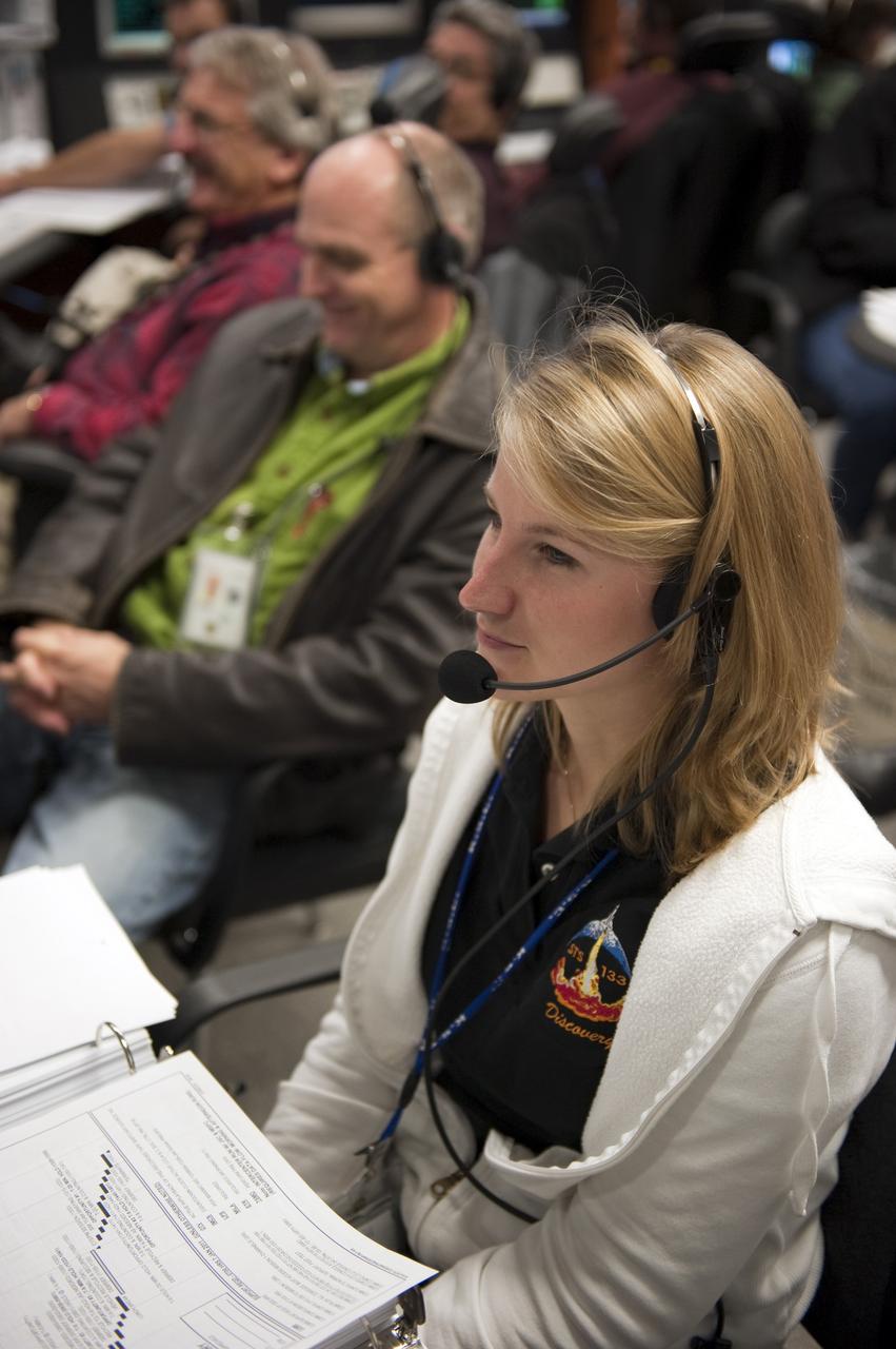 CAPE CANAVERAL, Fla. -- In the Launch Control Center at NASA's Kennedy Space Center in Florida, United Space Alliance Guidance and Navigation Engineer Jennifer Guida sits at her console in Firing Room 4 along with other STS-133 launch team members to rehearse procedures for the liftoff of space shuttle Discovery's final mission. The team at Kennedy also participated in launch simulations with personnel at NASA's Johnson Space Center in Houston. Discovery's next launch opportunity to the International Space Station on the STS-133 mission is planned for no earlier than Feb. 24. For more information on STS-133, visit www.nasa.gov/mission_pages/shuttle/shuttlemissions/sts133/. Photo credit: NASA/Kim Shiflett