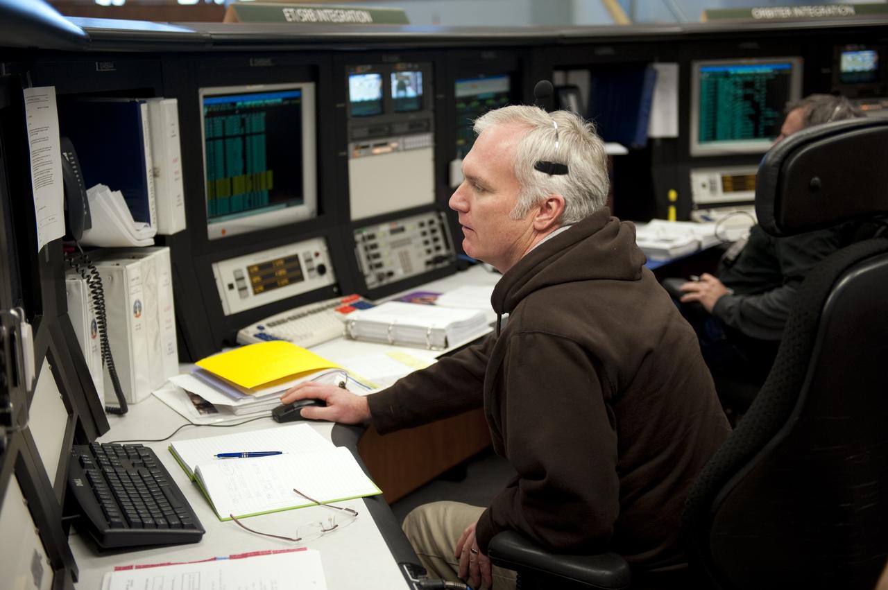 CAPE CANAVERAL, Fla. -- In the Launch Control Center at NASA's Kennedy Space Center in Florida, NASA Orbiter Project Engineer Todd Campbell sits at his console in Firing Room 4 along with other STS-133 launch team members to rehearse procedures for the liftoff of space shuttle Discovery's final mission. The team at Kennedy also participated in launch simulations with personnel at NASA's Johnson Space Center in Houston. Discovery's next launch opportunity to the International Space Station on the STS-133 mission is planned for no earlier than Feb. 24. For more information on STS-133, visit www.nasa.gov/mission_pages/shuttle/shuttlemissions/sts133/. Photo credit: NASA/Kim Shiflett