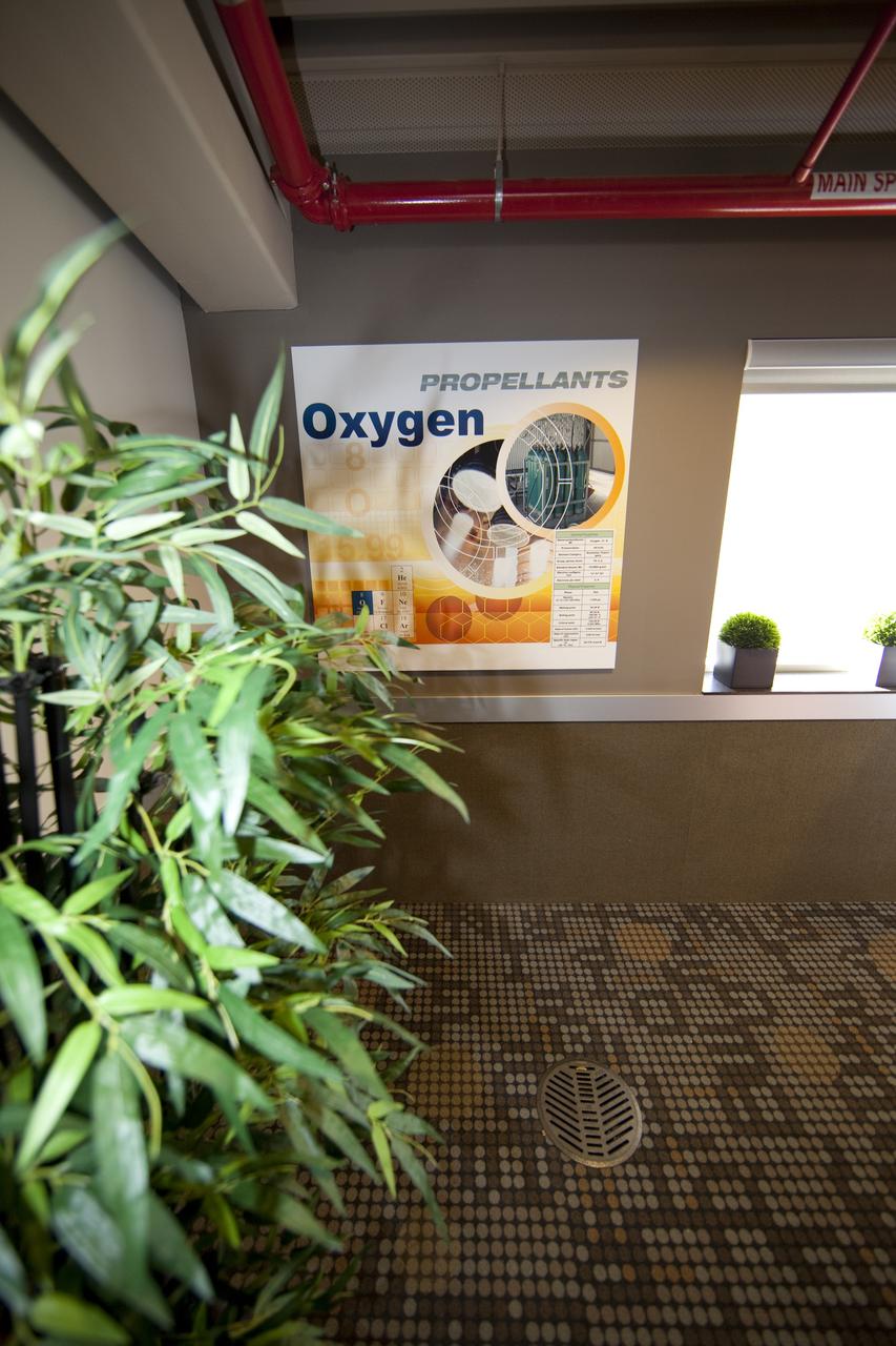 CAPE CANAVERAL, Fla. -- Finishing touches adorn the second-floor conference room of the Propellants North Administrative and Maintenance Facility at NASA's Kennedy Space Center in Florida. Artwork for the conference room was produced by Greg Lee, a graphics specialist with Abacus Technology Corp., with input from the facility's future occupants. The environmentally friendly facility is slated to be NASA's second Platinum-rated by the U.S. Green Building Council's (USGBC) Leadership in Environmental and Energy Design (LEED) certification system. It will be the space agency's first net-zero facility, which means it will produce enough energy onsite from renewable sources to offset what it requires to operate. The facility consists of a two-story administrative building to house managers, mechanics and technicians who fuel spacecraft at Kennedy, and a single-story shop to store cryogenic fuel transfer equipment. Photo credit: NASA/Frankie Martin