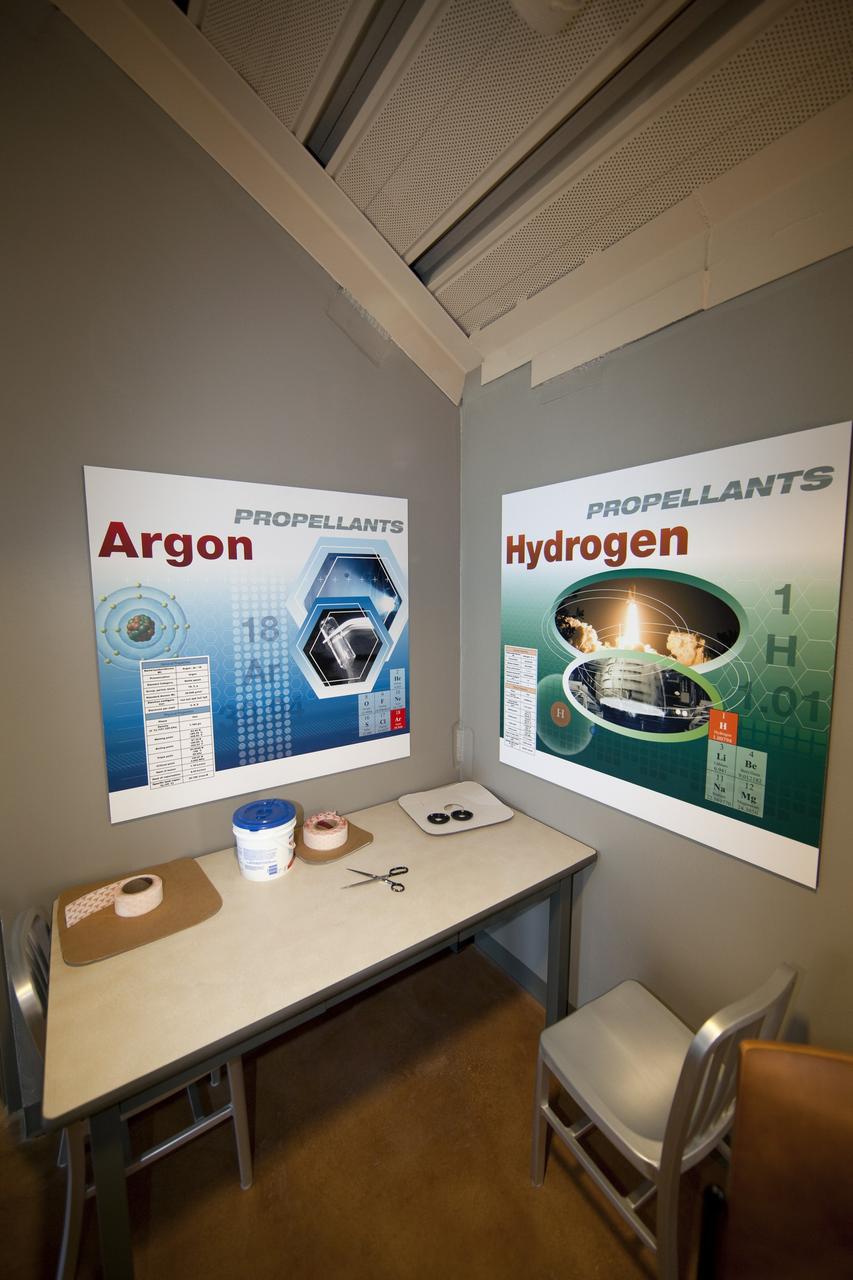 CAPE CANAVERAL, Fla. -- Finishing touches adorn the Propellants North Administrative and Maintenance Facility at NASA's Kennedy Space Center in Florida. Artwork for the facility was produced by Greg Lee, a graphics specialist with Abacus Technology Corp., with input from the facility's future occupants. The environmentally friendly facility is slated to be NASA's second Platinum-rated by the U.S. Green Building Council's (USGBC) Leadership in Environmental and Energy Design (LEED) certification system. It will be the space agency's first net-zero facility, which means it will produce enough energy onsite from renewable sources to offset what it requires to operate. The facility consists of a two-story administrative building to house managers, mechanics and technicians who fuel spacecraft at Kennedy, and a single-story shop to store cryogenic fuel transfer equipment. Photo credit: NASA/Frankie Martin