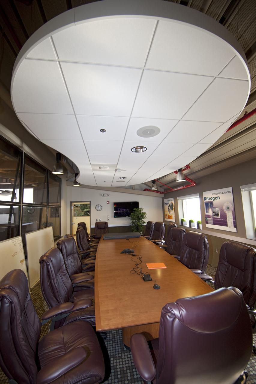 CAPE CANAVERAL, Fla. -- Finishing touches adorn the second-floor conference room of the Propellants North Administrative and Maintenance Facility at NASA's Kennedy Space Center in Florida. Artwork for the conference room was produced by Greg Lee, a graphics specialist with Abacus Technology Corp., with input from the facility's future occupants. The environmentally friendly facility is slated to be NASA's second Platinum-rated by the U.S. Green Building Council's (USGBC) Leadership in Environmental and Energy Design (LEED) certification system. It will be the space agency's first net-zero facility, which means it will produce enough energy onsite from renewable sources to offset what it requires to operate. The facility consists of a two-story administrative building to house managers, mechanics and technicians who fuel spacecraft at Kennedy, and a single-story shop to store cryogenic fuel transfer equipment. Photo credit: NASA/Frankie Martin