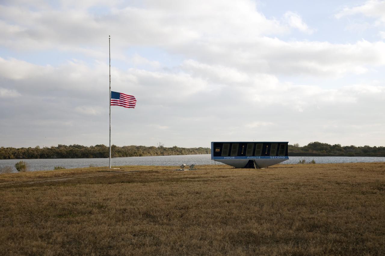 CAPE CANAVERAL, Fla. -- In accordance with a Presidential Proclamation, the American Flag in the Launch Complex 39 area of NASA's Kennedy Space Center in Florida flies at half-staff to honor U.S. Rep. Gabrielle Giffords and others who were wounded or killed during a shooting spree in Tucson, Arizona. This flag and all American Flags at U.S. military and government installations across the country and abroad will remain at half-staff until sunset on Jan. 14. Giffords is the wife of NASA astronaut Mark Kelly, who is scheduled to command space shuttle Endeavour's last mission, STS-134, to the International Space Station later this year.          Photo credit: NASA/Frankie Martin