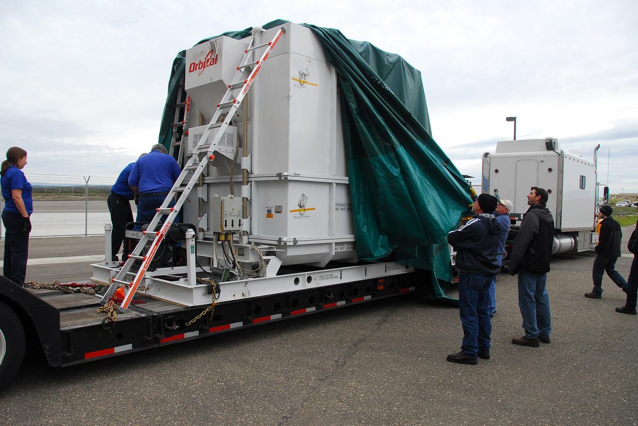 VANDENBERG AIR FORCE BASE, Calif. – The latest Earth-observing satellite developed by NASA, called Glory, arrives at the Astrotech Payload Processing Facility at Vandenberg Air Force Base in California by tractor-trailer. An Orbital Sciences Taurus XL rocket is targeted to launch Glory into low Earth orbit Feb. 23 from Vandenberg's Space Launch Complex 576-E.           Once in orbit, Glory will collect data on the properties of aerosols and black carbon. It also will help scientists understand how the sun's irradiance affects Earth's climate. Photo credit: NASA/Ed Henry, VAFB