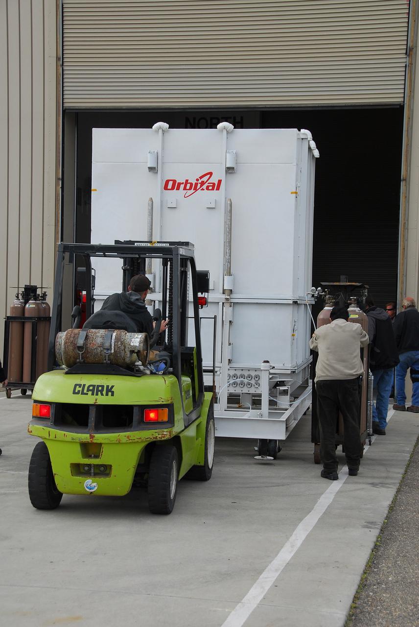 VANDENBERG AIR FORCE BASE, Calif. – The latest Earth-observing satellite developed by NASA, called Glory, arrives at the Astrotech Payload Processing Facility at Vandenberg Air Force Base in California by tractor-trailer. An Orbital Sciences Taurus XL rocket is targeted to launch Glory into low Earth orbit Feb. 23 from Vandenberg's Space Launch Complex 576-E.           Once in orbit, Glory will collect data on the properties of aerosols and black carbon. It also will help scientists understand how the sun's irradiance affects Earth's climate. Photo credit: NASA/Ed Henry, VAFB