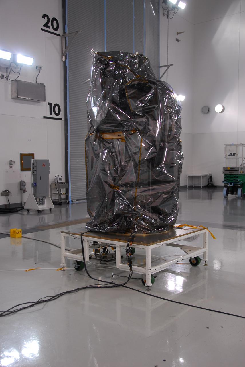 VANDENBERG AIR FORCE BASE, Calif. -- Inside the Astrotech payload processing facility at Vandenberg Air Force Base in California, NASA's Glory spacecraft will be removed from its protective covering. Next, the spacecraft will be encapsulated in its protective payload fairing before it is transported to Space Launch Complex 576-E and joined with the Taurus XL rocket's third stage. Once Glory reaches orbit, it will collect data on the properties of aerosols and black carbon. It also will help scientists understand how the sun's irradiance affects Earth's climate. Launch is scheduled for 5:09 a.m. EST Feb. 23. For information, visit www.nasa.gov/glory. Photo credit: NASA/Ed Henry, VAFB