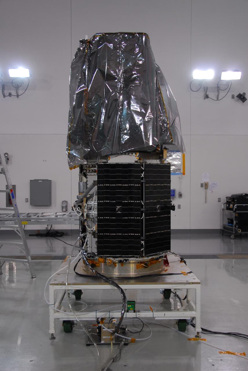 VANDENBERG AIR FORCE BASE, Calif. -- Inside the Astrotech payload processing facility at Vandenberg Air Force Base in California, technicians removed most of the protective covering surrounding NASA's Glory spacecraft. Next, the spacecraft will be encapsulated in its protective payload fairing before it is transported to Space Launch Complex 576-E and joined with the Taurus XL rocket's third stage. Once Glory reaches orbit, it will collect data on the properties of aerosols and black carbon. It also will help scientists understand how the sun's irradiance affects Earth's climate. Launch is scheduled for 5:09 a.m. EST Feb. 23. For information, visit www.nasa.gov/glory. Photo credit: NASA/Ed Henry, VAFB