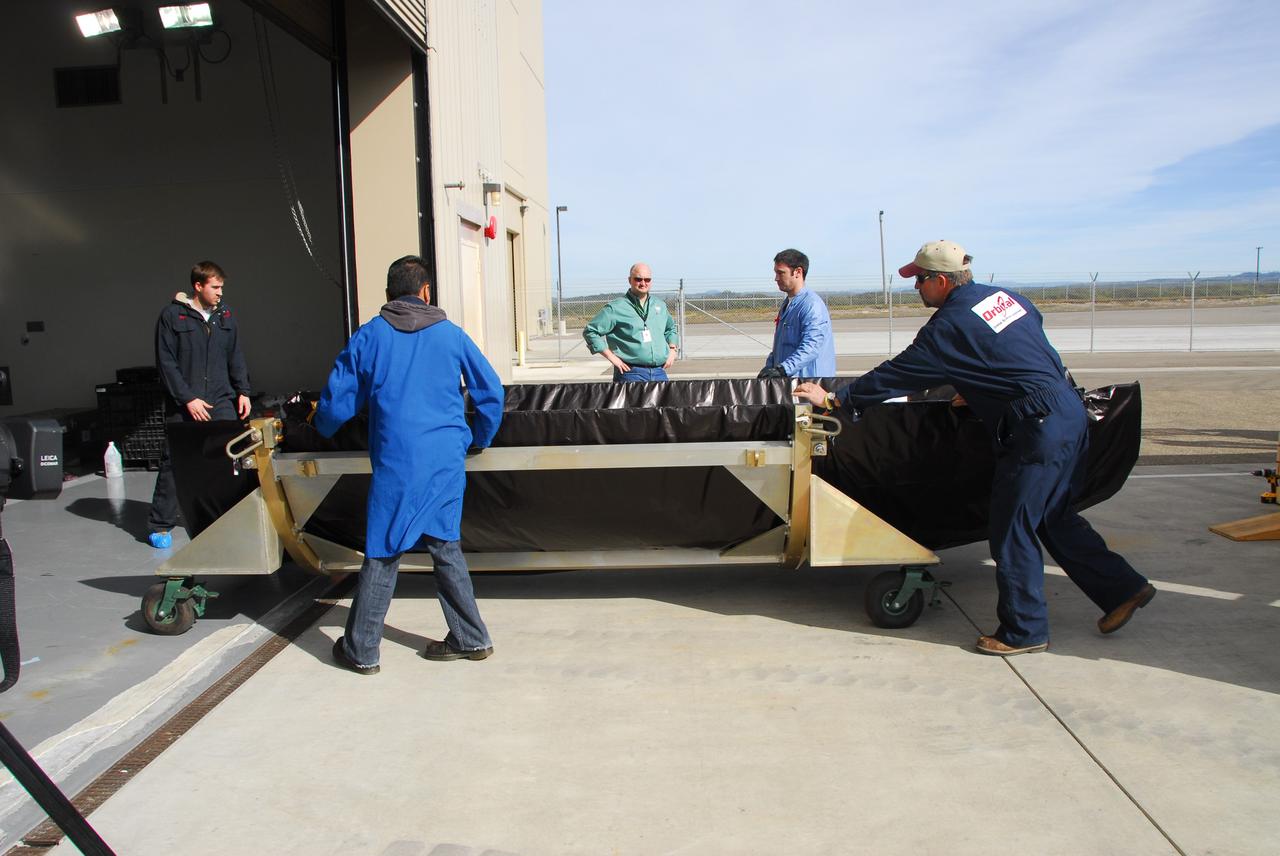 VANDENBERG AIR FORCE BASE, Calif. -- At Vandenberg Air Force Base in California, the protective payload fairing that will surround NASA's Glory spacecraft arrives at the Astrotech payload processing facility. Once encapsulated, the spacecraft will be transported to Space Launch Complex 576-E and joined with the Taurus XL rocket's third stage.           Once Glory reaches orbit, it will collect data on the properties of aerosols and black carbon. It also will help scientists understand how the sun's irradiance affects Earth's climate. Launch is scheduled for 5:09 a.m. EST Feb. 23. For information, visit www.nasa.gov/glory. Photo credit: NASA/Ed Henry, VAFB