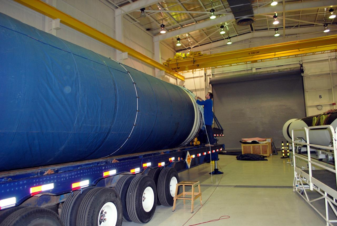 VANDENBERG AIR FORCE BASE, Calif. -- Inside the Orbital Sciences Corp. Building 1555 at Vandenberg Air Force Base in California, a worker installs a protective blanket over the Stage 0 motor in preparation for its move to Space Launch Complex 576-E, scheduled for Jan. 17. As part of the four-stage Taurus XL rocket that will carry NASA's Glory spacecraft into low Earth orbit, stages 1, 2 and 3 will join Stage 0 at the launch pad about a week later. Once Glory reaches orbit, it will collect data on the properties of aerosols and black carbon. It also will help scientists understand how the sun's irradiance affects Earth's climate. Launch is scheduled for 5:09 a.m. EST Feb. 23. For information, visit www.nasa.gov/glory. Photo credit: NASA/Randy Beaudoin, VAFB