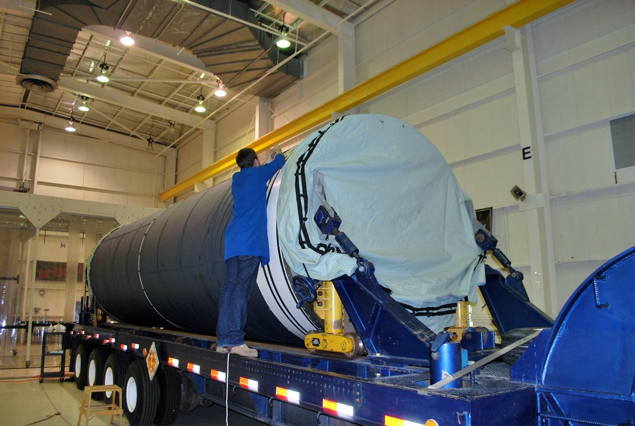 VANDENBERG AIR FORCE BASE, Calif. -- Inside the Orbital Sciences Corp. Building 1555 at Vandenberg Air Force Base in California, a worker installs a protective blanket over the Stage 0 motor in preparation for its move to Space Launch Complex 576-E, scheduled for Jan. 17. As part of the four-stage Taurus XL rocket that will carry NASA's Glory spacecraft into low Earth orbit, stages 1, 2 and 3 will join Stage 0 at the launch pad about a week later. Once Glory reaches orbit, it will collect data on the properties of aerosols and black carbon. It also will help scientists understand how the sun's irradiance affects Earth's climate. Launch is scheduled for 5:09 a.m. EST Feb. 23. For information, visit www.nasa.gov/glory. Photo credit: NASA/Randy Beaudoin, VAFB