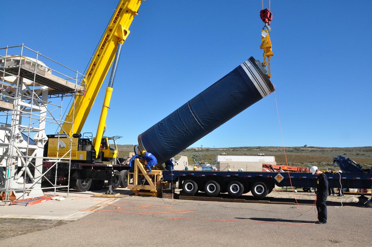 VANDENBERG AIR FORCE BASE, Calif. -- The Stage 0 motor of the Orbital Sciences Corp. Taurus XL is hoisted into launch position by crane at Space Launch Complex 576-E at Vandenberg Air Force Base in California. As part of the four-stage Taurus XL rocket that will carry NASA's Glory spacecraft into low Earth orbit, stages 1, 2 and 3 will join Stage 0 at the launch pad about a week later.         Once Glory reaches orbit, it will collect data on the properties of aerosols and black carbon. It also will help scientists understand how the sun's irradiance affects Earth's climate. Launch is scheduled for 5:09 a.m. EST Feb. 23. For information, visit www.nasa.gov/glory. Photo credit: NASA/Randy Beaudoin, VAFB