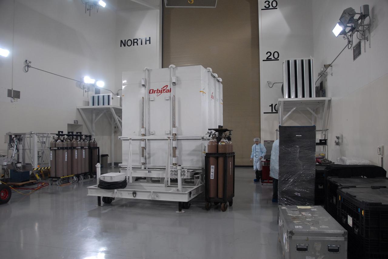 VANDENBERG AIR FORCE BASE, Calif. -- Inside the Astrotech processing facility at Vandenberg Air Force Base in California, the shipping container surrounding NASA's Glory spacecraft is ready for removal.  Next, technicians will take off Glory's protective covering before it is encapsulated in a protective payload fairing for flight. In early February, Glory is scheduled to be transported Space Launch Complex 576-E where it will be joined with the Taurus XL rocket, which is manufactured by Orbital Sciences Corp.          Once Glory reaches orbit, it will collect data on the properties of aerosols and black carbon. It also will help scientists understand how the sun's irradiance affects Earth's climate. Launch is scheduled for 5:09 a.m. EST Feb. 23. For information, visit www.nasa.gov/glory. Photo credit: NASA/Ed Henry, VAFB