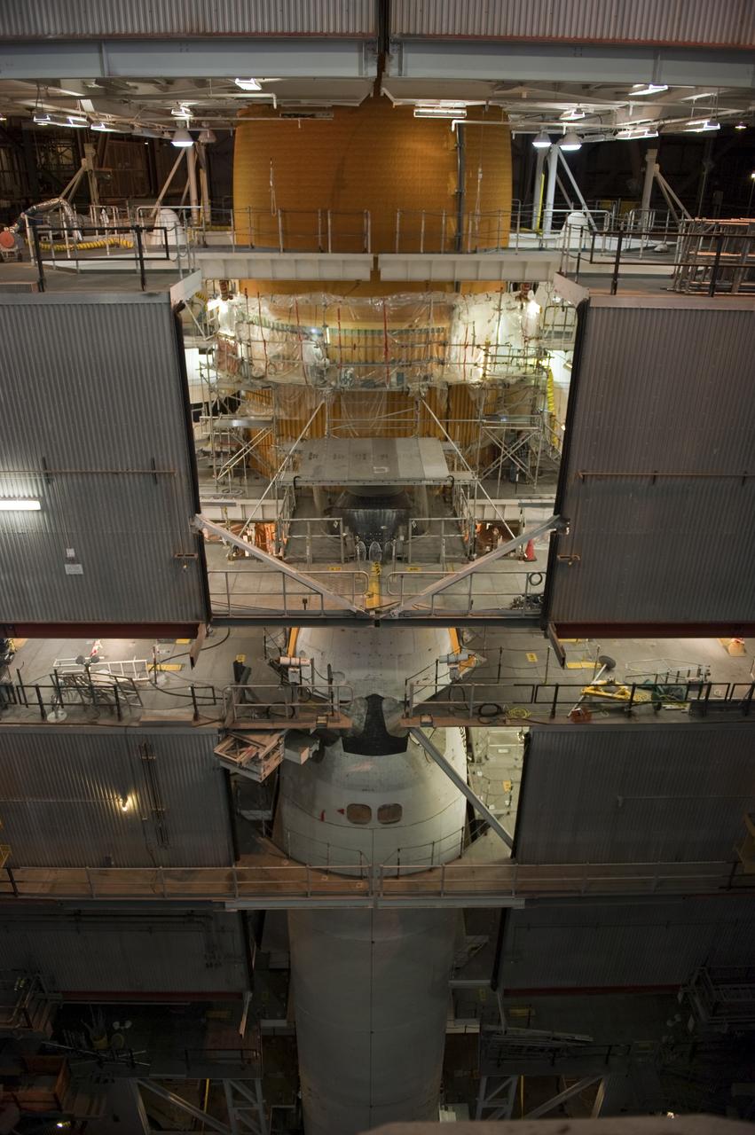 CAPE CANAVERAL, Fla. -- Repair work to space shuttle Discovery's external fuel tank continues in the Vehicle Assembly Building at NASA's Kennedy Space Center in Florida. Technicians are modifying 94 support beams, called stringers, on the tank's intertank region by fitting pieces of metal, called radius blocks, over the stringers' edges. After the modifications of the stringers are complete, foam insulation will be re-applied to the tank. Discovery's next launch opportunity to the International Space Station on the STS-133 mission is targeted for Feb. 24, 2011. For more information on STS-133, visit www.nasa.gov/mission_pages/shuttle/shuttlemissions/sts133/. Photo credit: NASA/Kim Shiflett