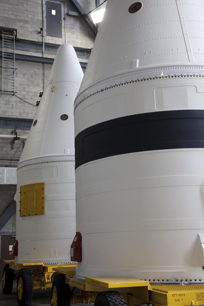 CAPE CANAVERAL, Fla. -- At NASA's Kennedy Space Center in Florida, the Space Shuttle Program's final solid rocket booster assembly is stationed in the transfer aisle of the Vehicle Assembly Building. The right and left forward assemblies, which were refurbished and processed at Kennedy, are comprised of three components -- nose cap, frustum and forward skirt. Inside the Vehicle Assembly Building, the boosters will be stacked and then joined to an external fuel tank and space shuttle Atlantis for the STS-135 mission to the International Space Station. STS-135 is targeted to launch June 28, and will be the last spaceflight for the Space Shuttle Program. Photo credit: NASA/Frank Michaux