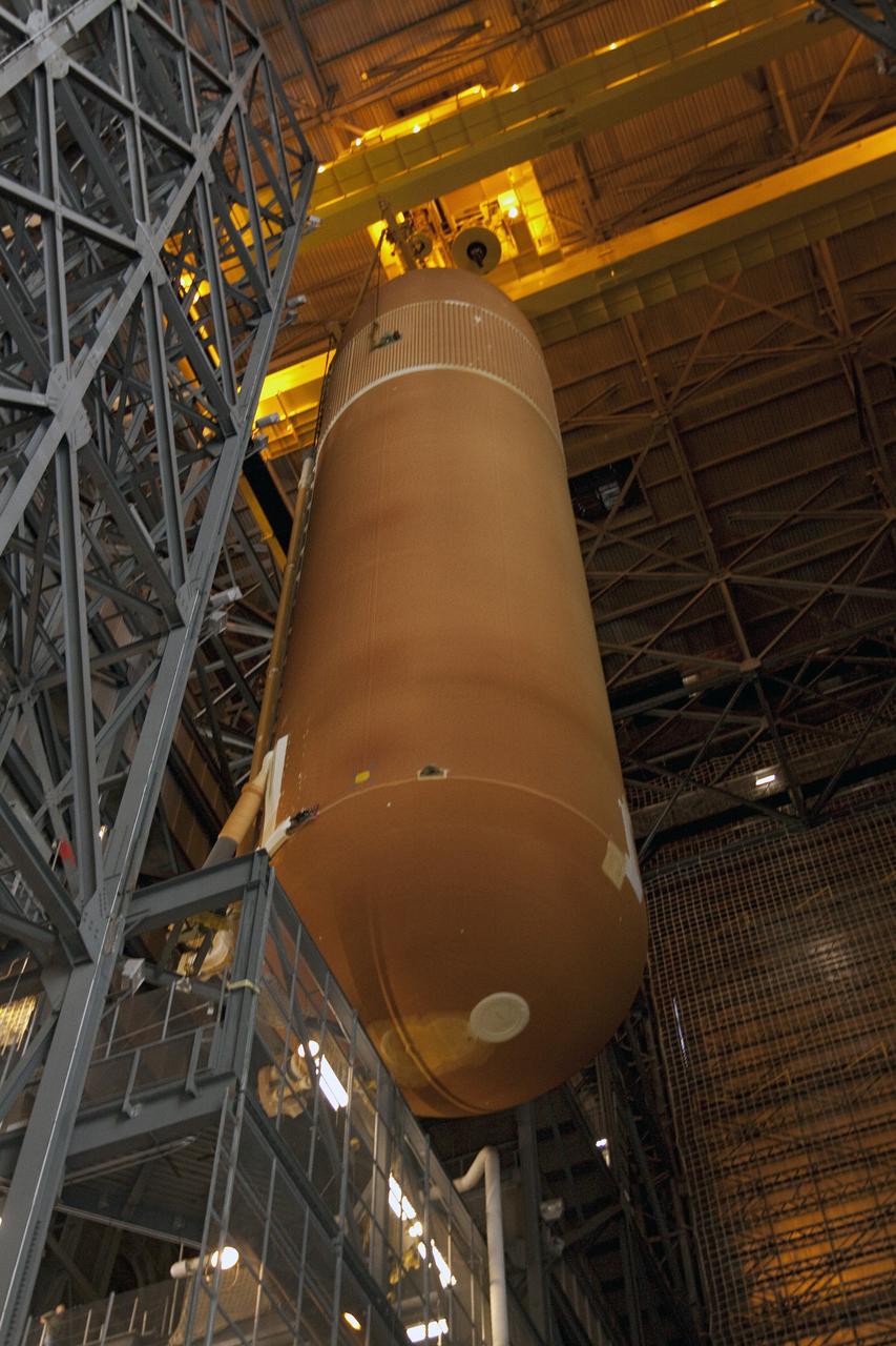 CAPE CANAVERAL, Fla. -- In the Vehicle Assembly Building at NASA's Kennedy Space Center in Florida, external fuel tank,   ET-122, for space shuttle Endeavour's STS-134 mission, is being lifted from its test cell. When lowered in place, the tank will be attached to the solid rocket boosters on the mobile launcher platform. Endeavour and its crew will deliver the Express Logistics Carrier-3 and the Alpha Magnetic Spectrometer to the International Space Station. Launch is targeted for April 19. For more information visit, http://www.nasa.gov/mission_pages/shuttle/shuttlemissions/sts134/index.html. Photo credit: NASA/Jack Pfaller