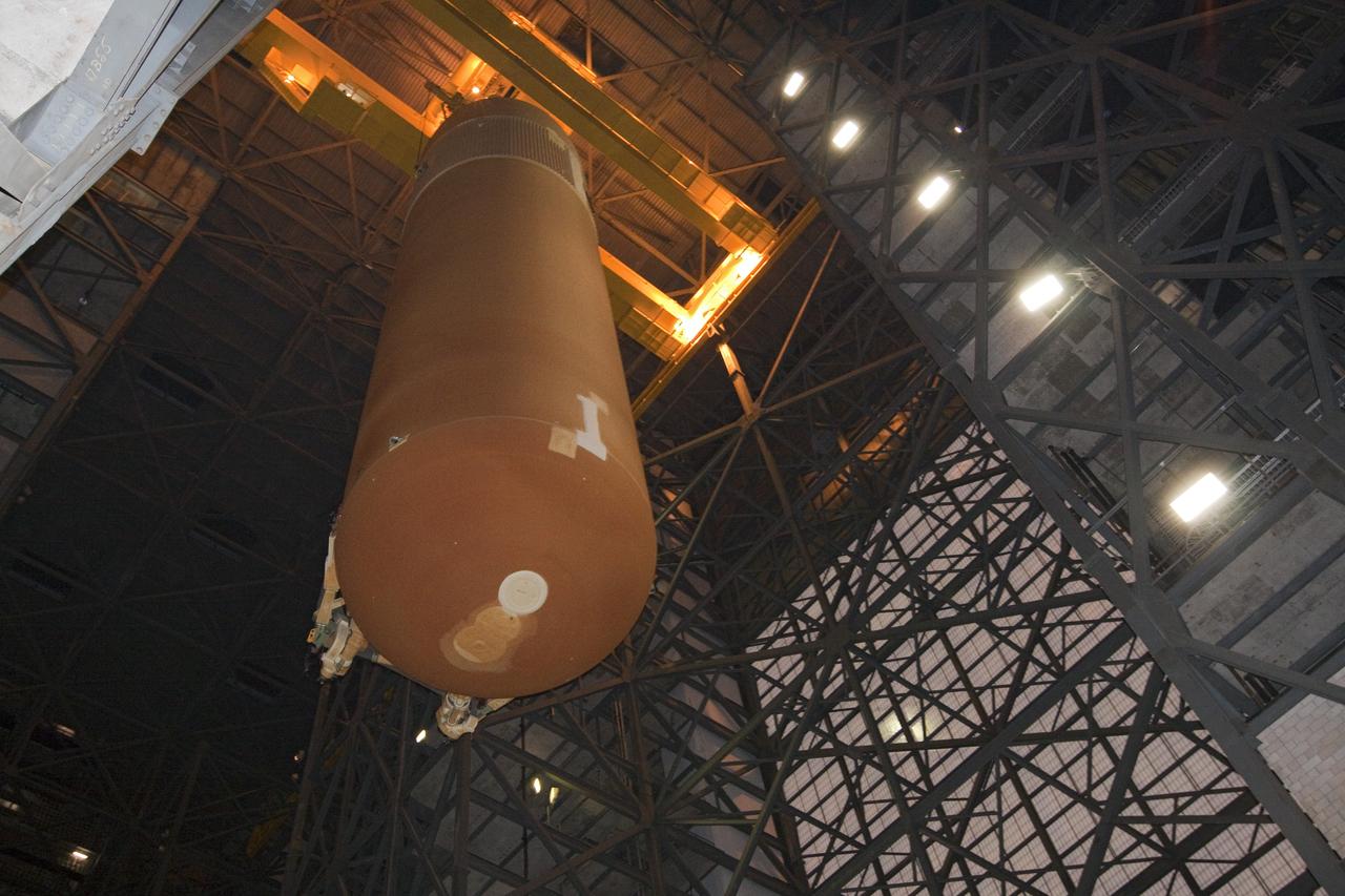 CAPE CANAVERAL, Fla. -- In the Vehicle Assembly Building at NASA's Kennedy Space Center in Florida, external fuel tank, ET-122, for space shuttle Endeavour's STS-134 mission, is suspended over the transfer aisle. When lowered in place, the tank will be attached to the solid rocket boosters on the mobile launcher platform. Endeavour and its crew will deliver the Express Logistics Carrier-3 and the Alpha Magnetic Spectrometer to the International Space Station. Launch is targeted for April 19. For more information visit, http://www.nasa.gov/mission_pages/shuttle/shuttlemissions/sts134/index.html. Photo credit: NASA/Jack Pfaller