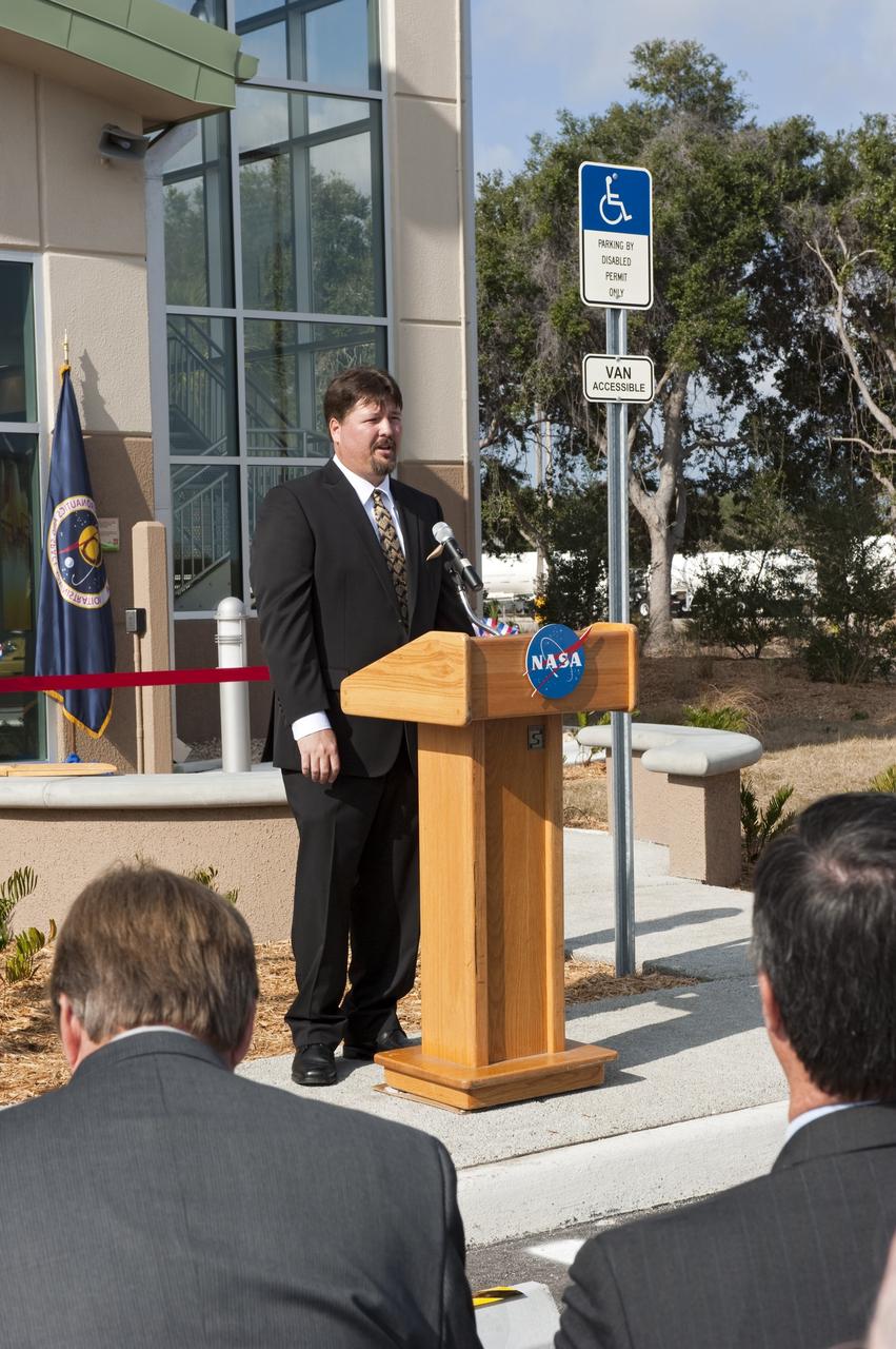 CAPE CANAVERAL, Fla. -- Frank Kline, Construction of Facilities project manager at NASA's Kennedy Space Center in Florida, addresses an audience at the ribbon-cutting ceremony for the new environmentally friendly Propellants North Administration and Maintenance Facility. Propellants North consists of two buildings, one to store cryogenic fuel transfer equipment and one to house personnel who support fueling spacecraft. The recently rebuilt buildings will be NASA's first carbon neutral facility, which means it will produce enough energy on site from renewable sources to offset what it requires to operate. The facility also will reach for the U.S. Green Building Council's Leadership in Environmental and Energy Design (LEED) Platinum status, which is the highest LEED rating. Photo credit: NASA/Kim Shiflett