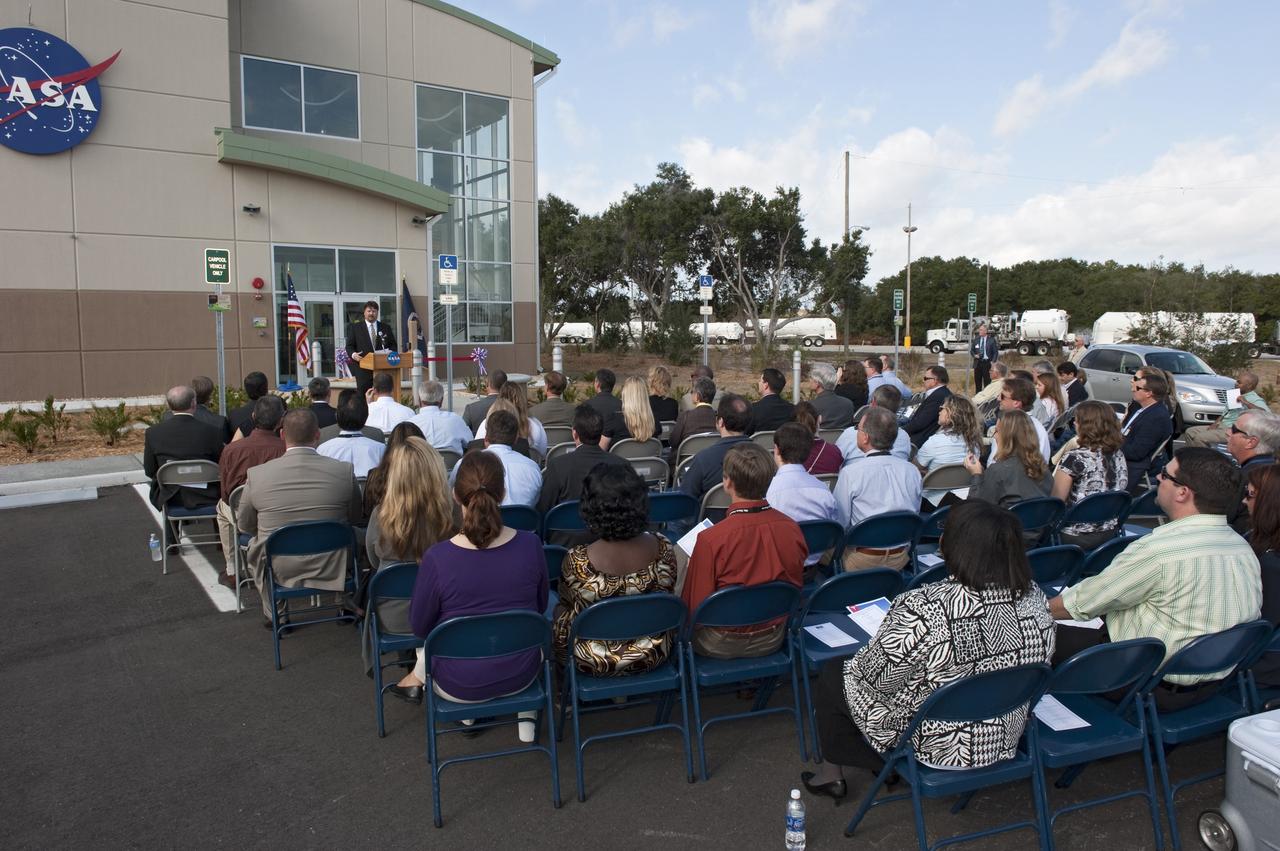CAPE CANAVERAL, Fla. -- Frank Kline, Construction of Facilities project manager at NASA's Kennedy Space Center in Florida, addresses an audience at the ribbon-cutting ceremony for the new environmentally friendly Propellants North Administration and Maintenance Facility.          Propellants North consists of two buildings, one to store cryogenic fuel transfer equipment and one to house personnel who support fueling spacecraft. The recently rebuilt buildings will be NASA's first carbon neutral facility, which means it will produce enough energy on site from renewable sources to offset what it requires to operate. The facility also will reach for the U.S. Green Building Council's Leadership in Environmental and Energy Design (LEED) Platinum status, which is the highest LEED rating. Photo credit: NASA/Kim Shiflett