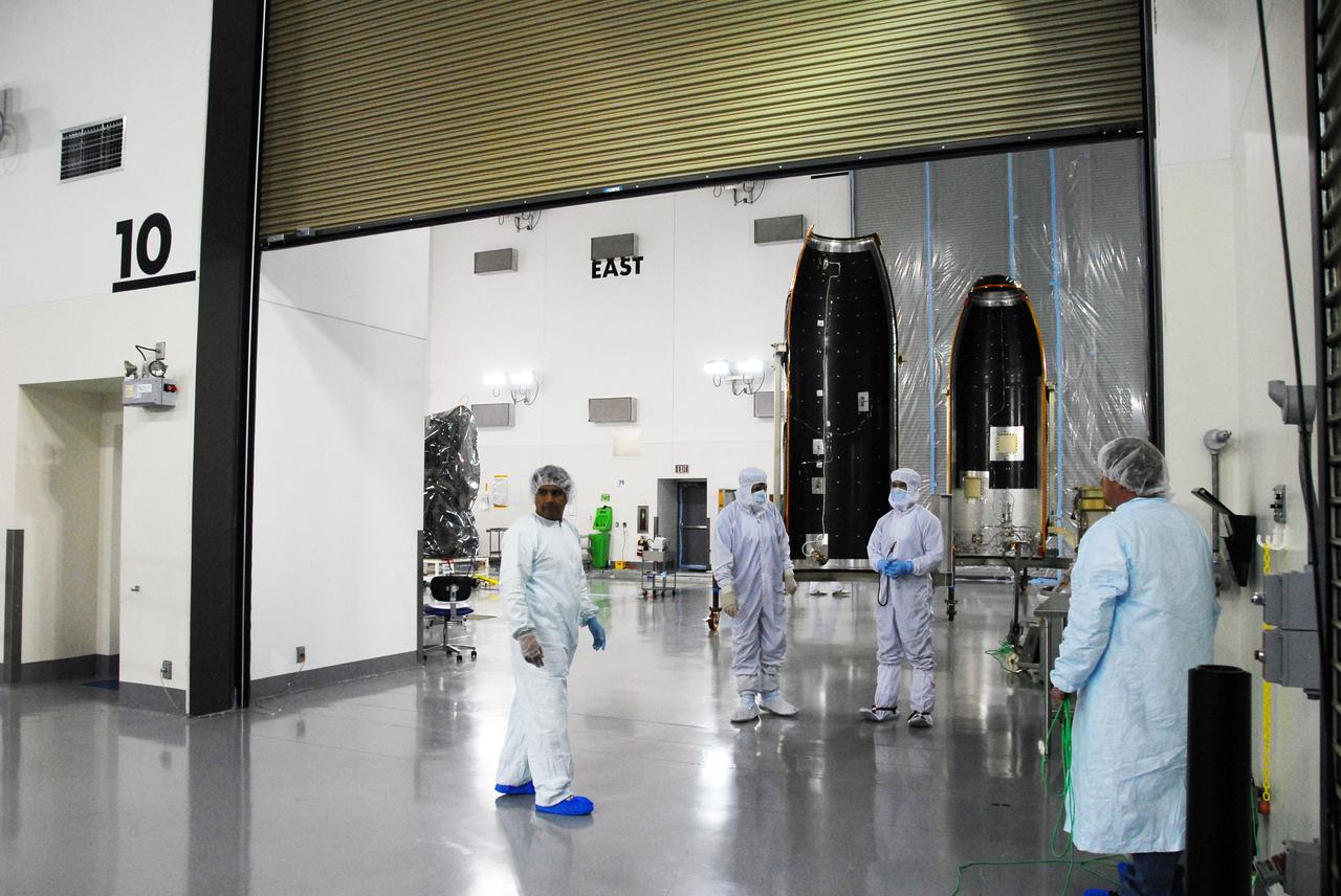 VANDENBERG AIR FORCE BASE, Calif. -- The payload fairing for the Glory mission stands in the East High Bay at the Astrotech payload processing facility at Vandenberg Air Force Base in California. The payload fairing will cover the Glory spacecraft  and be placed at the top of a Taurus XL rocket slated to lift the spacecraft into orbit. The payload fairing will protect the Glory spacecraft from aerodynamic pressures and heating during the first part of its climb into orbit. Once Glory reaches orbit, it will collect data on the properties of aerosols and black carbon. It also will help scientists understand how the sun's irradiance affects Earth's climate. Launch is scheduled for 5:09 a.m. EST Feb. 23. For information, visit www.nasa.gov/glory. Photo credit: NASA/Ed Henry, VAFB