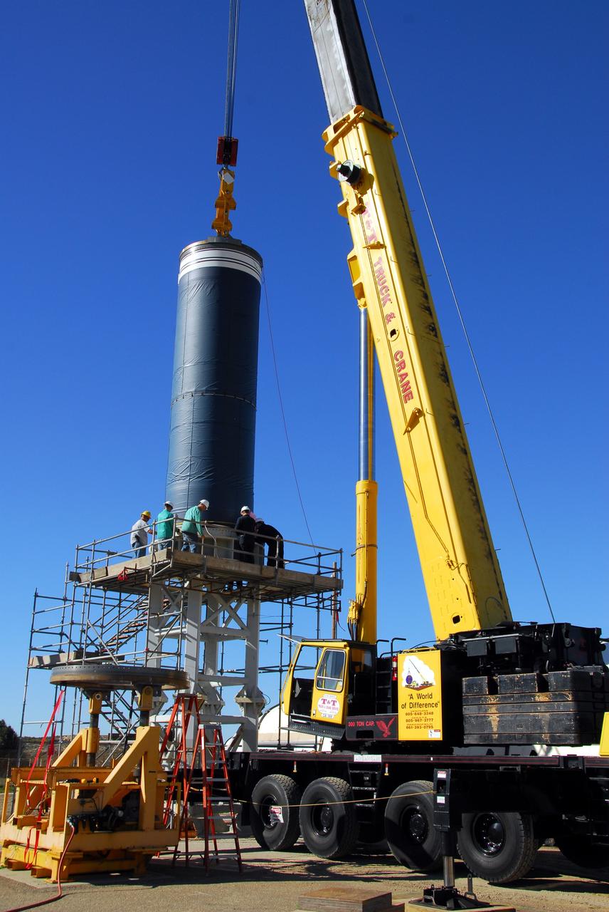 VANDENBERG AIR FORCE BASE, Calif. -- Workers move the Stage 0 motor of the Orbital Sciences Corp. Taurus XL into launch position on Space Launch Complex 576-E at Vandenberg Air Force Base in California. As part of the four-stage Taurus XL rocket that will carry NASA's Glory spacecraft into low Earth orbit, stages 1, 2 and 3 will join Stage 0 at the launch pad about a week later.        Once Glory reaches orbit, it will collect data on the properties of aerosols and black carbon. It also will help scientists understand how the sun's irradiance affects Earth's climate. Launch is scheduled for 5:09 a.m. EST Feb. 23. For information, visit www.nasa.gov/glory. Photo credit: NASA/Don Kosoksa, VAFB