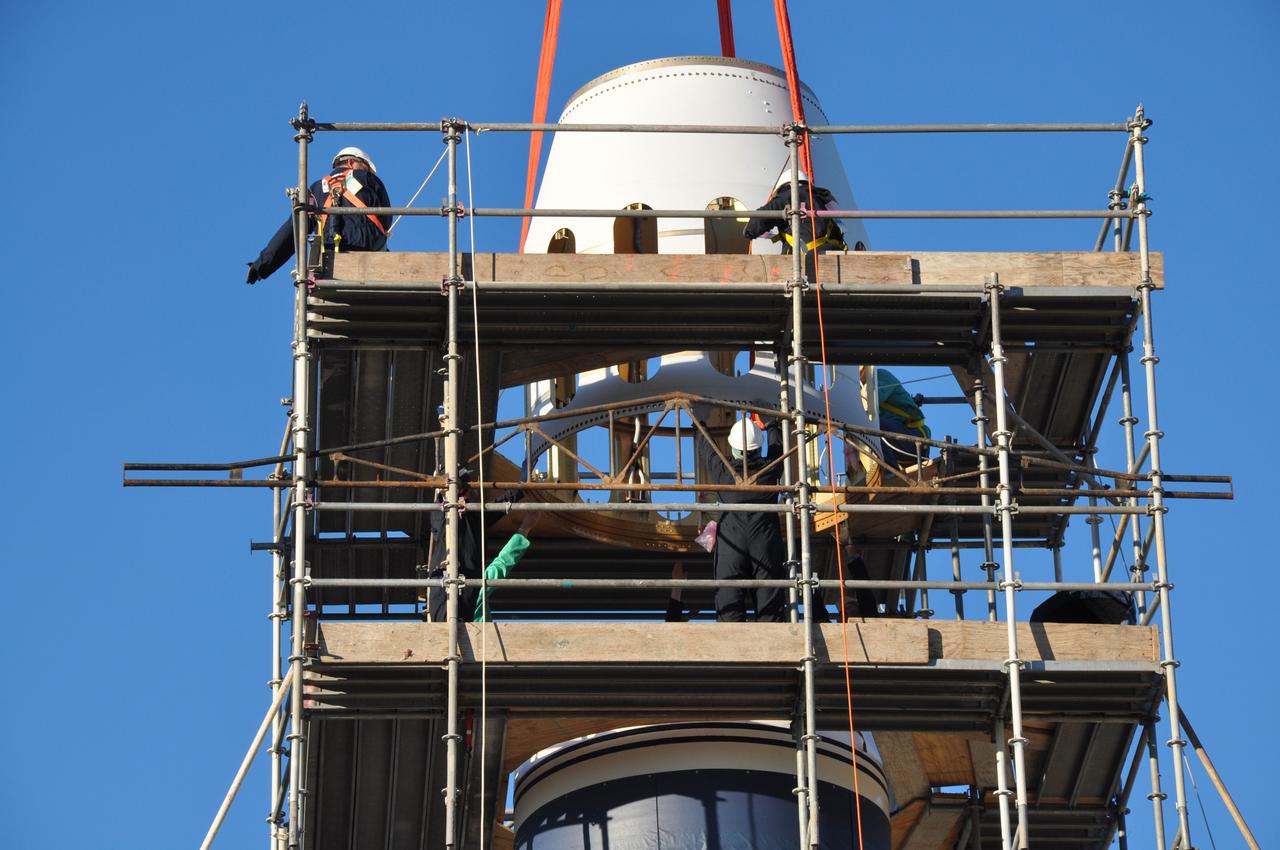 VANDENBERG AIR FORCE BASE, Calif. -- Workers at Vandenberg Air Force Base in California, guide the Stage 0/1 interstage, part of the four-stage Taurus XL rocket that will carry NASA's Glory spacecraft into low Earth orbit, into launch position at Space Launch Complex 576-E. Once Glory reaches orbit, it will collect data on the properties of aerosols and black carbon. It also will help scientists understand how the sun's irradiance affects Earth's climate. Launch is scheduled for 5:09 a.m. EST Feb. 23. For information, visit www.nasa.gov/glory. Photo credit: NASA/Randy Beaudoin, VAFB