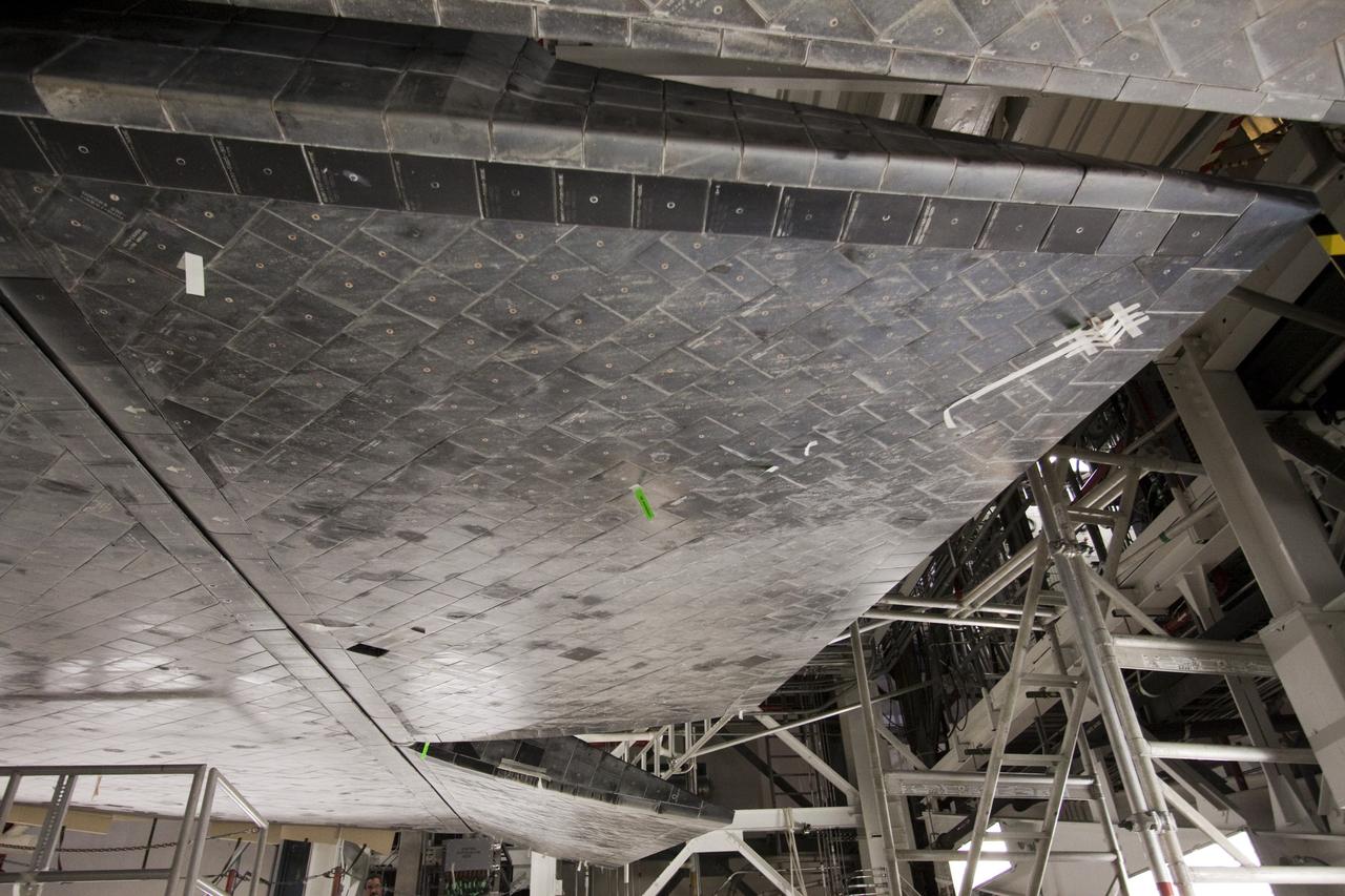 CAPE CANAVERAL, Fla. -- Space shuttle Atlantis  goes through a routine landing gear test in Orbiter Processing Facility-1 at NASA's Kennedy Space Center in Florida. Technicians are checking to make sure the shuttle's wheels, brakes, elevons and body flap function properly. Seen here, an elevon is tested. Elevons are located on the trailing edge of each wing and help control pitch of the shuttle as it comes in for landing.        Atlantis is being prepared for the STS-135 mission, which will deliver the Raffaello multi-purpose logistics module packed with supplies, logistics and spare parts to the International Space Station. STS-135 is targeted to launch June 28, and will be the last spaceflight for the Space Shuttle Program. Photo credit: NASA/Jack Pfaller