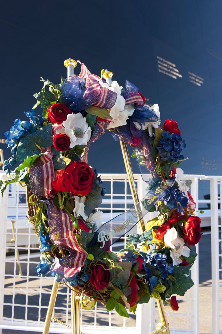 CAPE CANAVERAL, Fla. -- A wreath is displayed at the foot of the Space Mirror Memorial at the Kennedy Space Center Visitor Complex in Florida during a Day of Remembrance ceremony to honor members of the NASA family who lost their lives while furthering the cause of exploration and discovery. The memorial honors 24 United States astronauts, including the crew members of space shuttles Columbia and Challenger, Apollo 1, and those who died in training and commercial airplane accidents.              The memorial is a project of the Astronauts Memorial Foundation and was paid for by Florida residents who purchased special Challenger mission automobile license plates. 2011 marks the 25th anniversary of the loss of Challenger, which broke apart over the Atlantic Ocean 73 seconds into flight on Jan. 28, 1986. Photo credit: NASA/Kim Shiflett
