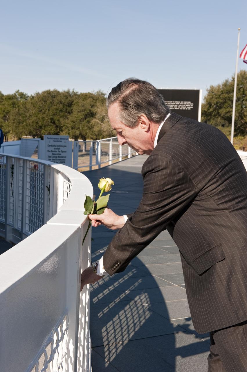 CAPE CANAVERAL, Fla. -- President and C.E.O. of The Astronauts Memorial Foundation Stephen Feldman displays a single yellow rose near the Space Mirror Memorial at the Kennedy Space Center Visitor Complex in Florida during a Day of Remembrance ceremony to honor members of the NASA family who lost their lives while furthering the cause of exploration and discovery. The memorial honors 24 United States astronauts, including the crew members of space shuttles Columbia and Challenger, Apollo 1, and those who died in training and commercial airplane accidents. The memorial is a project of the Astronauts Memorial Foundation and was paid for by Florida residents who purchased special Challenger mission automobile license plates. 2011 marks the 25th anniversary of the loss of Challenger, which broke apart over the Atlantic Ocean 73 seconds into flight on Jan. 28, 1986. Photo credit: NASA/Kim Shiflett