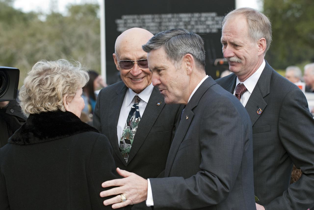 CAPE CANAVERAL, Fla. -- Dr. June Scobee Rodgers, the founding chair of the Challenger Center for Space Science Education and widow of space shuttle Challenger's STS-51L Commander Dick Scobee, left, talks with former Shuttle Launch Director Bob Sieck, NASA Kennedy Space Center Director Bob Cabana and NASA Associate Administrator for Space Operations William Gerstenmaier. They are gathered in front of the Space Mirror Memorial at the Kennedy Space Center Visitor Complex in Florida to honor the Challenger crew members who gave their lives for while furthering the cause of exploration and discovery. 2011 marks the 25th anniversary of the loss of Challenger, which broke apart over the Atlantic Ocean 73 seconds into flight on Jan. 28, 1986.           Photo credit: NASA/Kim Shiflett
