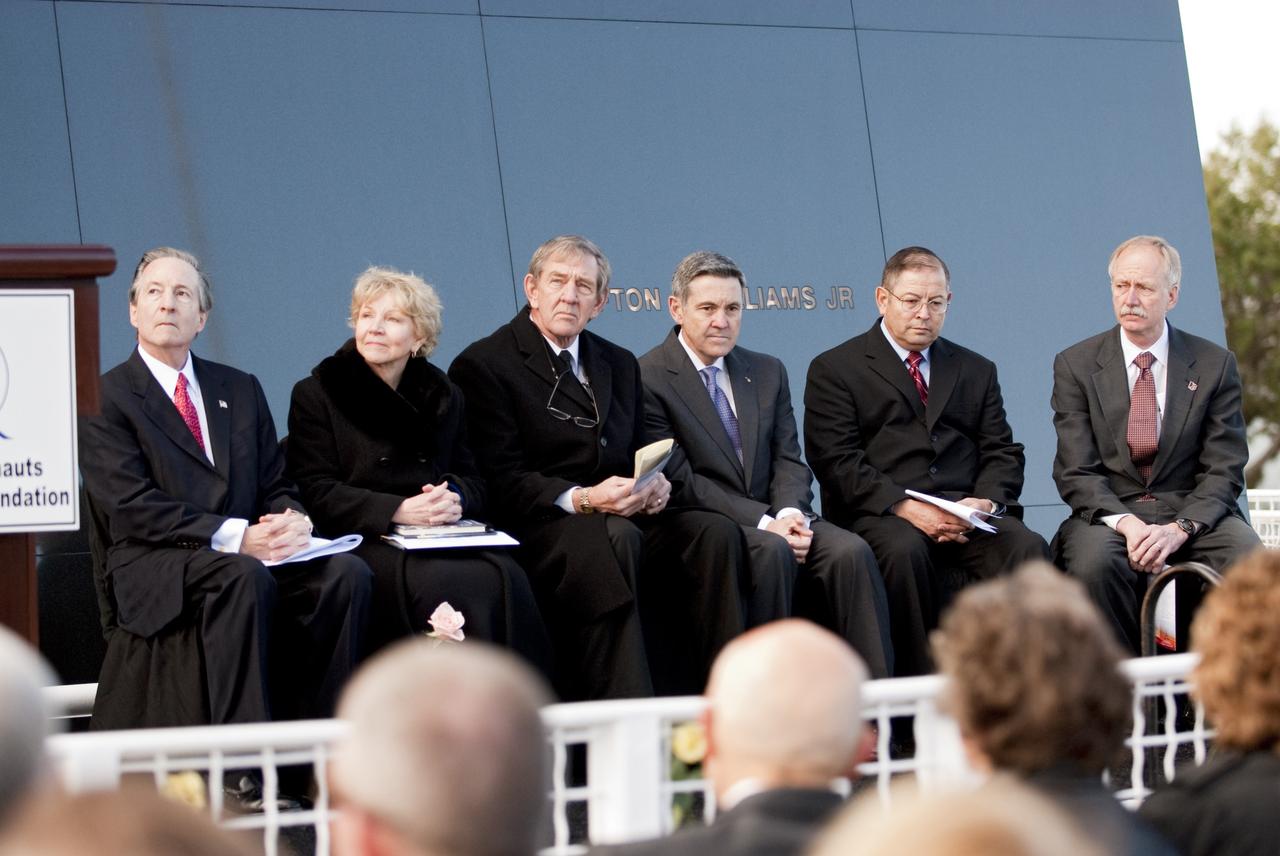 CAPE CANAVERAL, Fla. -- Stephen Feldman, president of The Astronauts Memorial Foundation, left; Dr. June Scobee Rodgers, founding chair of the Challenger Center for Space Science Education and widow of space shuttle Challenger's STS-51L Commander Dick Scobee; Michael McCulley, former astronaut and chairman of The Astronauts Memorial Foundation; Bob Cabana, former astronaut and NASA Kennedy Space Center director; Rick Soria, 2009 Alan Shepard Technology in Education Award winner, and William Gerstenmaier, NASA Associate Administrator for Space Operations gather in front of the Space Mirror Memorial at the Kennedy Space Center Visitor Complex in Florida to honor the Challenger crew members who gave their lives for while furthering the cause of exploration and discovery. 2011 marks the 25th anniversary of the loss of Challenger, which broke apart over the Atlantic Ocean 73 seconds into flight on Jan. 28, 1986.           Photo credit: NASA/Kim Shiflett