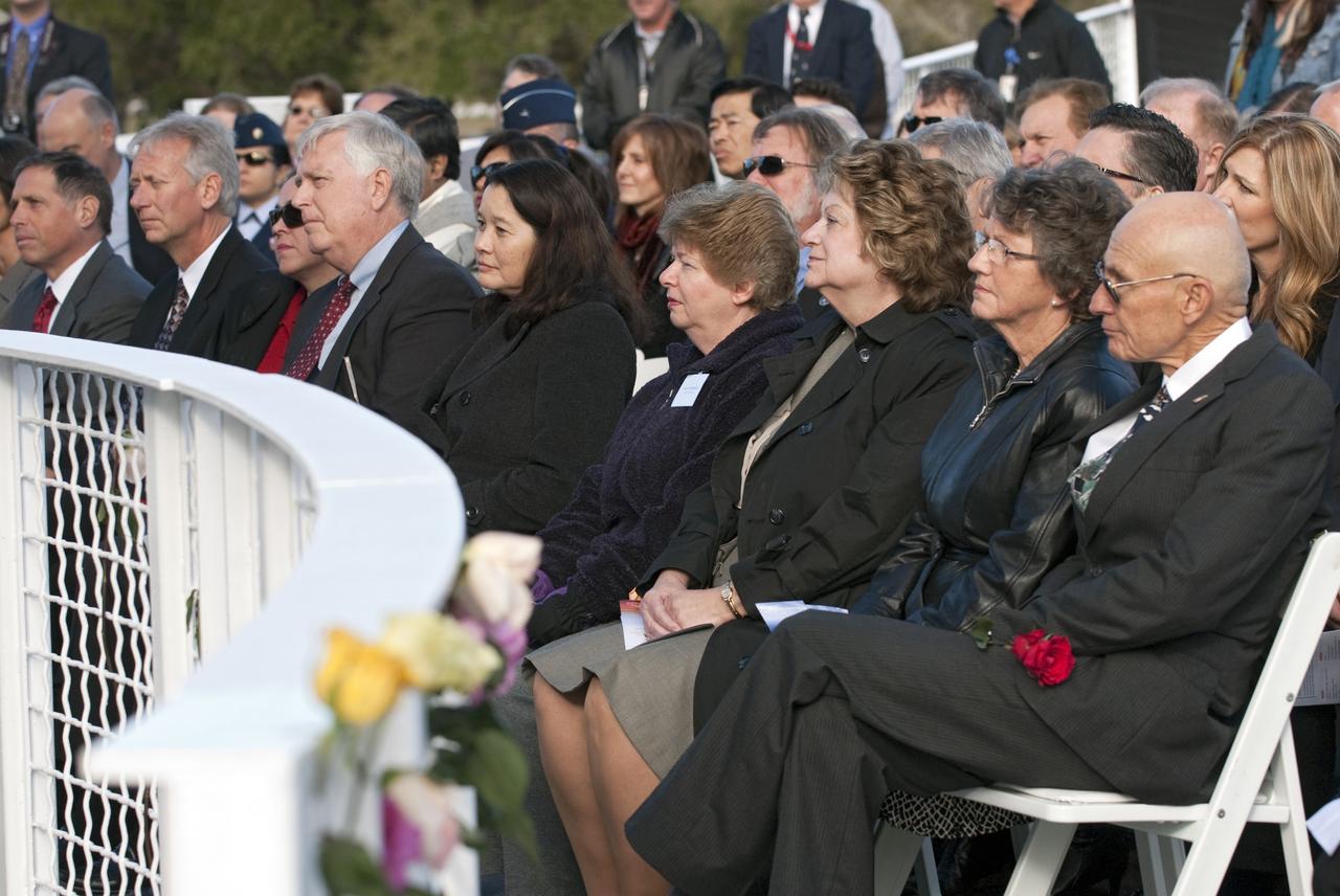 CAPE CANAVERAL, Fla. -- A crowd gathers in front of the Space Mirror Memorial at the Kennedy Space Center Visitor Complex in Florida to honor space shuttle Challenger's STS-51L crew members who gave their lives for while furthering the cause of exploration and discovery. 2011 marks the 25th anniversary of the loss of Challenger, which broke apart over the Atlantic Ocean 73 seconds into flight on Jan. 28, 1986.           Photo credit: NASA/Kim Shiflett