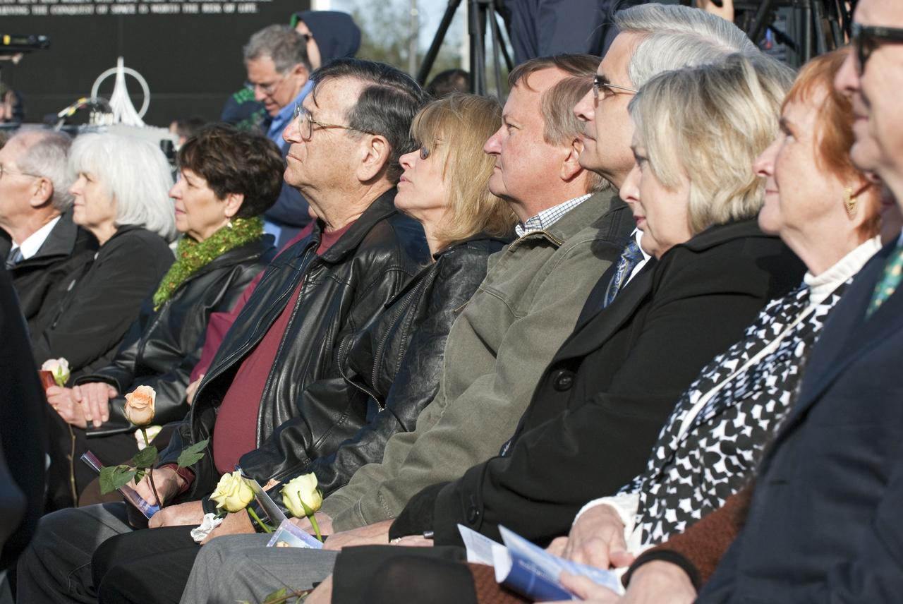 CAPE CANAVERAL, Fla. -- A crowd gathers in front of the Space Mirror Memorial at the Kennedy Space Center Visitor Complex in Florida to honor space shuttle Challenger's STS-51L crew members who gave their lives for while furthering the cause of exploration and discovery. 2011 marks the 25th anniversary of the loss of Challenger, which broke apart over the Atlantic Ocean 73 seconds into flight on Jan. 28, 1986.           Photo credit: NASA/Kim Shiflett
