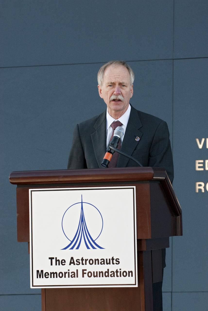CAPE CANAVERAL, Fla. -- NASA Associate Administrator for Space Operations William Gerstenmaier speaks to a crowd gathered in front of the Space Mirror Memorial at the Kennedy Space Center Visitor Complex in Florida to honor space shuttle Challenger's STS-51L crew members who gave their lives for while furthering the cause of exploration and discovery. 2011 marks the 25th anniversary of the loss of Challenger, which broke apart over the Atlantic Ocean 73 seconds into flight on Jan. 28, 1986.         Photo credit: NASA/Kim Shiflett