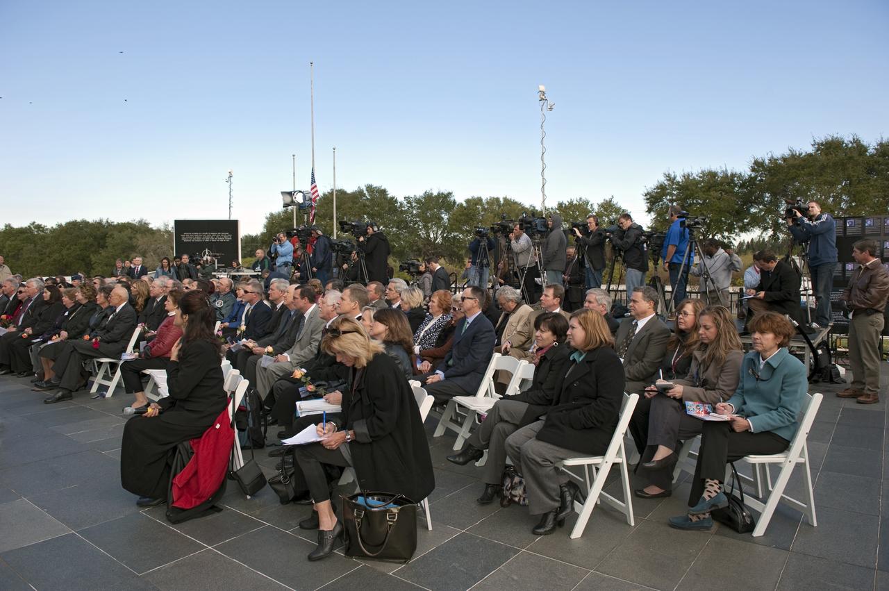 CAPE CANAVERAL, Fla. -- A crowd gathers in front of the Space Mirror Memorial at the Kennedy Space Center Visitor Complex in Florida to honor space shuttle Challenger's STS-51L crew members who gave their lives for while furthering the cause of exploration and discovery. 2011 marks the 25th anniversary of the loss of Challenger, which broke apart over the Atlantic Ocean 73 seconds into flight on Jan. 28, 1986.       Photo credit: NASA/Kim Shiflett