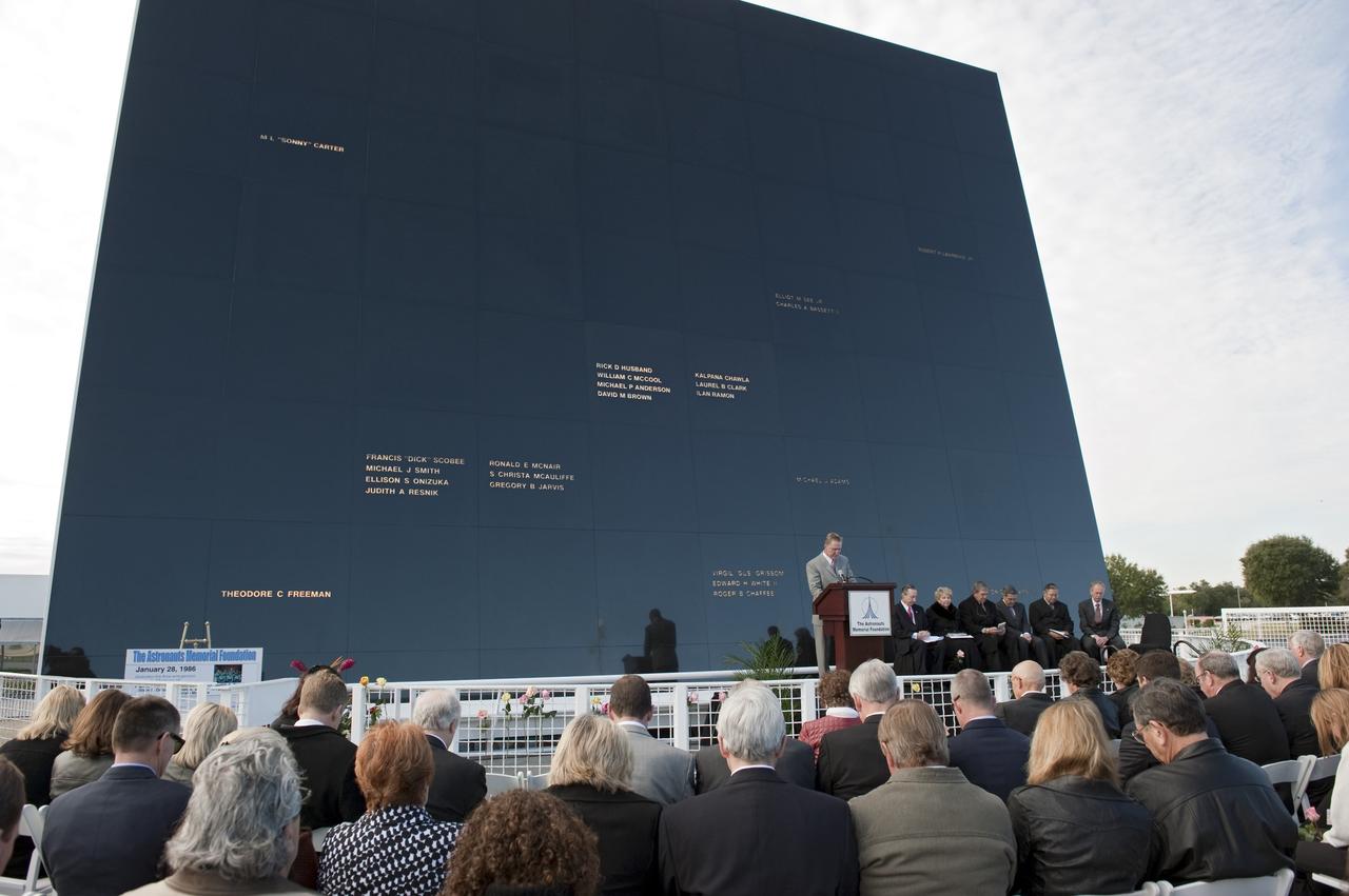 CAPE CANAVERAL, Fla. -- Mick Ukleja, from The Astronauts Memorial Foundation, provides the invocation in front of the Space Mirror Memorial at the Kennedy Space Center Visitor Complex in Florida to honor space shuttle Challenger's STS-51L crew members who gave their lives for while furthering the cause of exploration and discovery. 2011 marks the 25th anniversary of the loss of Challenger, which broke apart over the Atlantic Ocean 73 seconds into flight on Jan. 28, 1986.     Photo credit: NASA/Kim Shiflett